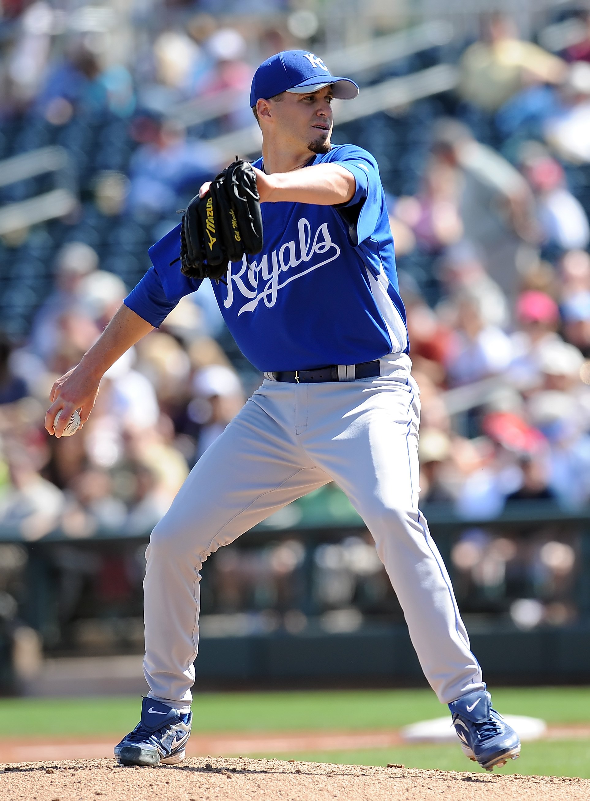 SURPRISE, AZ - MARCH 06:  Gil Meche #55 of the Kansas City Royals pitches during a Spring Training game against the Texas Rangers on March 6, 2010 in Surprise, Arizona.  (Photo by Lisa Blumenfeld/Getty Images)