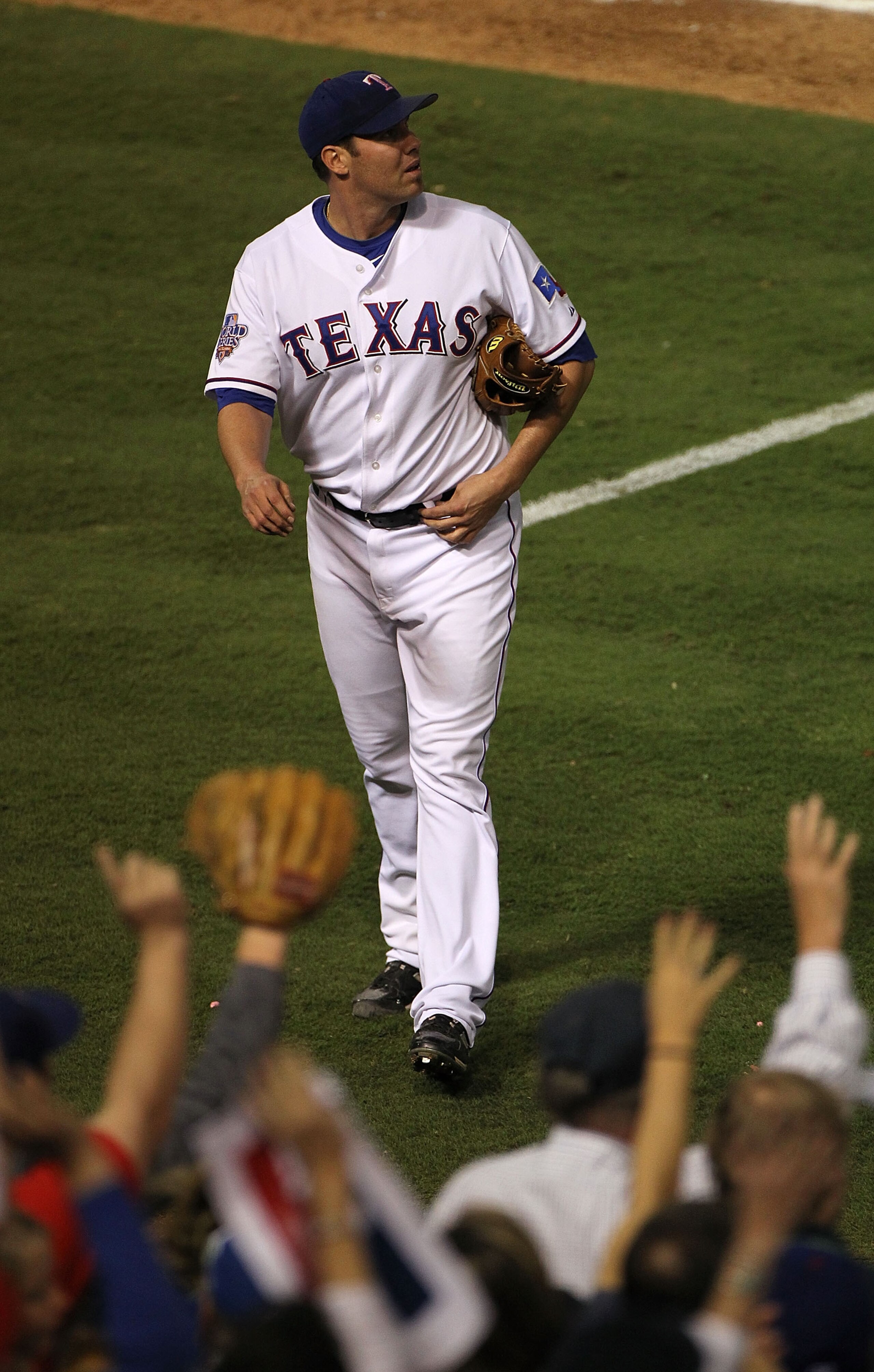 ARLINGTON, TX - OCTOBER 30:  Colby Lewis #48 of the Texas Rangers walks to the dugout in the eigth inning against the San Francisco Giants in Game Three of the 2010 MLB World Series at Rangers Ballpark in Arlington on October 30, 2010 in Arlington, Texas.