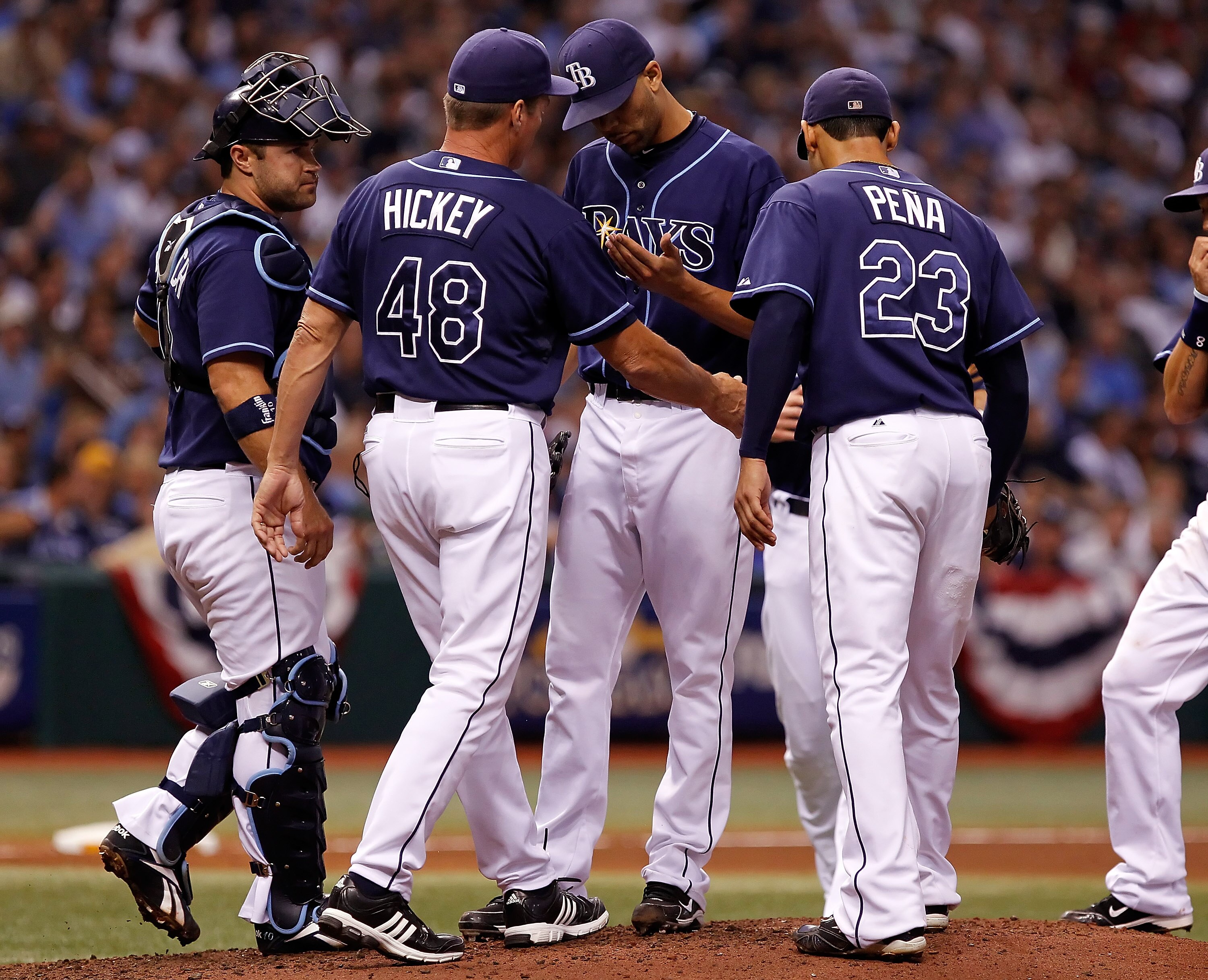 ST. PETERSBURG - OCTOBER 12:  Pitching coach Jim Hickey #48 of the Tampa Bay Rays talks with pitcher David Price #14 against the Texas Rangers during Game 5 of the ALDS at Tropicana Field on October 12, 2010 in St. Petersburg, Florida.  (Photo by J. Meric