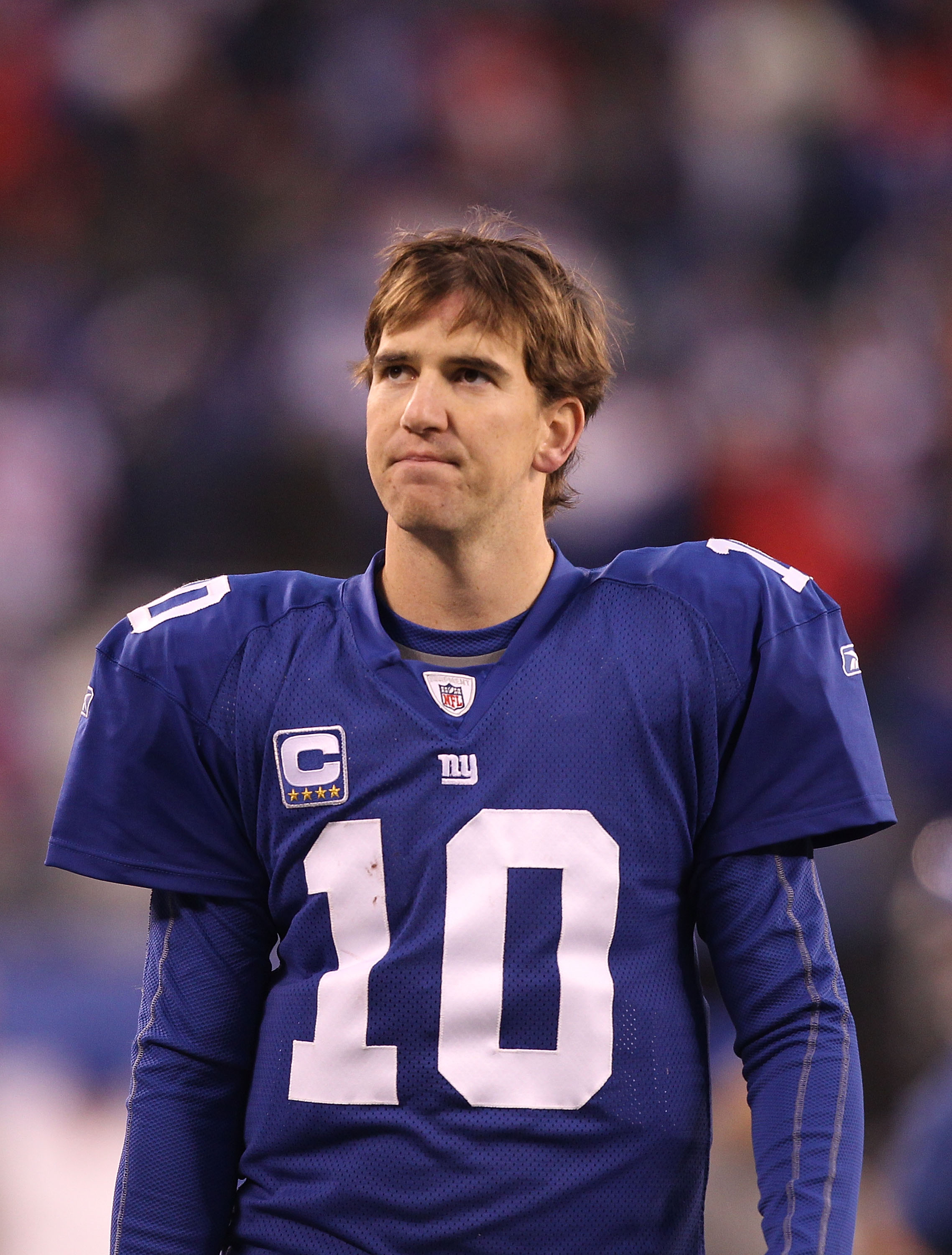 EAST RUTHERFORD, NJ - DECEMBER 19:  Eli Manning #10 of the New York Giants walks off the field dejected after losing to the Philadelphia Eagles 38-31  on December 19, 2010 at The New Meadowlands Stadium in East Rutherford, New Jersey.  (Photo by Al Bello/