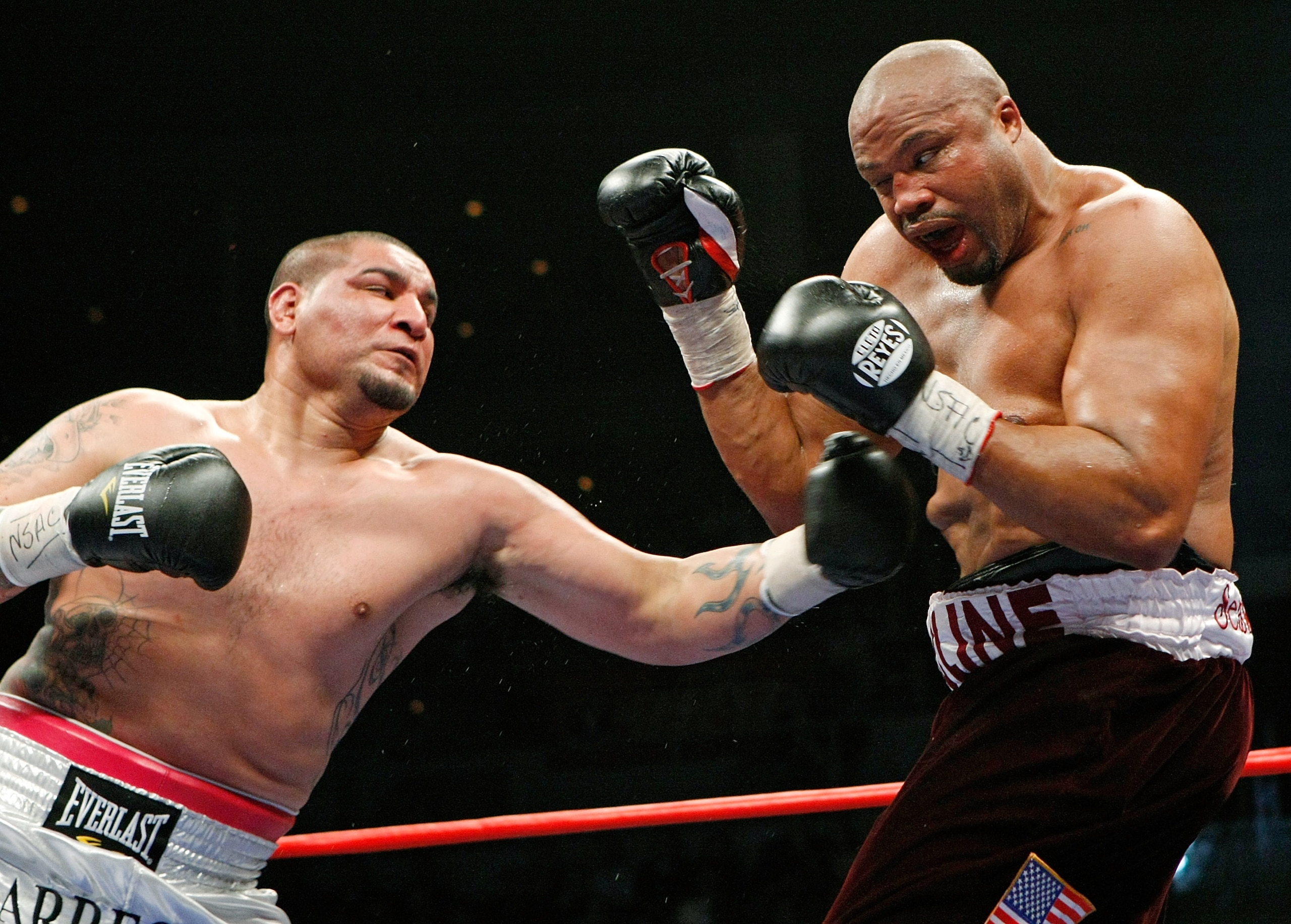 LAS VEGAS - APRIL 11:  Chris Arreola (L) hits Jameel McCline in the fourth round of their heavyweight bout at the Mandalay Bay Events Center April 11, 2009 in Las Vegas, Nevada. Arreola won by knockout in the fourth round.  (Photo by Ethan Miller/Getty Im