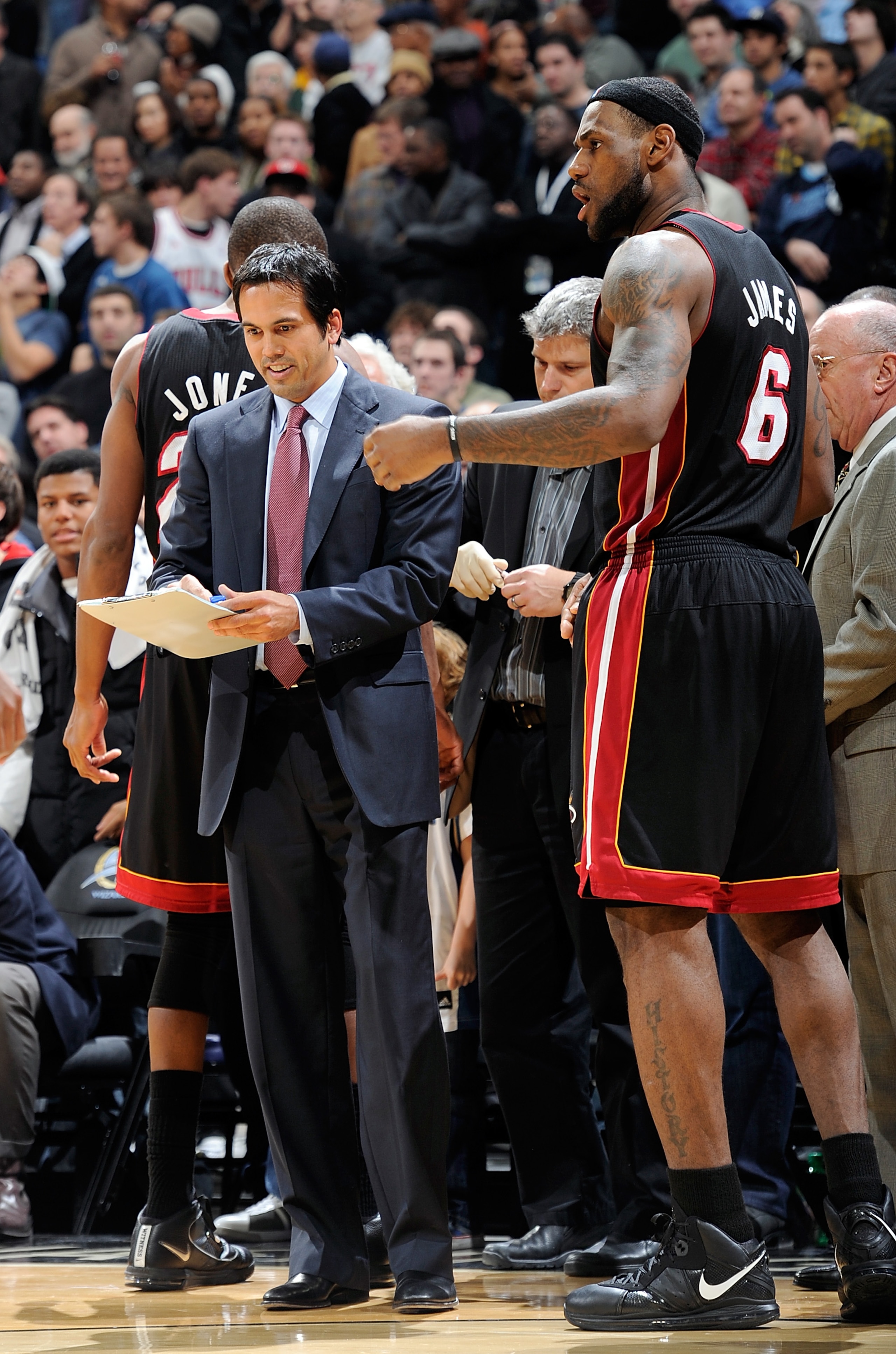 WASHINGTON, DC - DECEMBER 18:  Head coach Eric Spoelstra of the Miami Heat talks with LeBron James #6 during a timeout in the game against the Washington Wizards at the Verizon Center on December 18, 2010 in Washington, DC. NOTE TO USER: User expressly ac