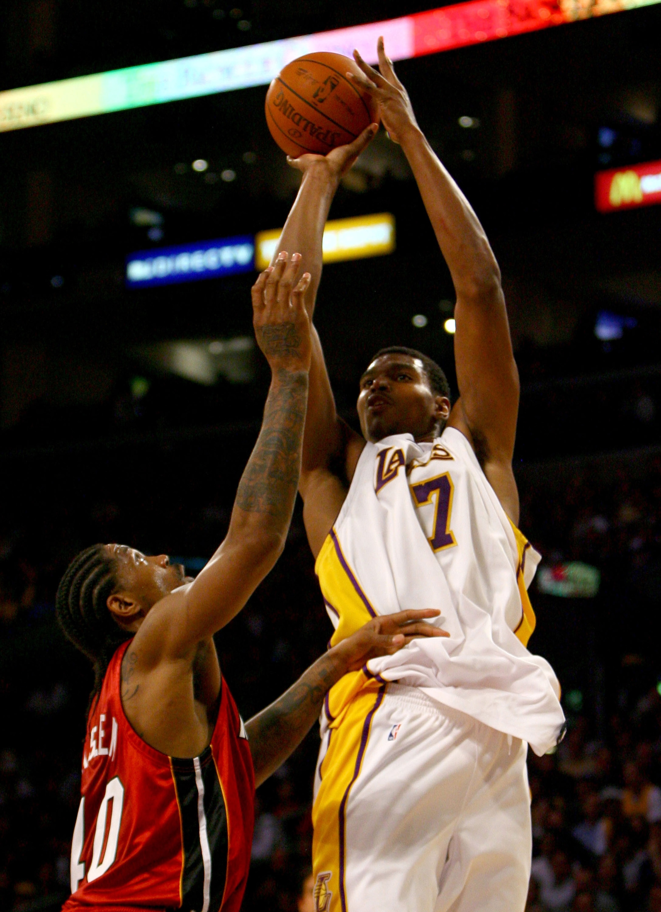 LOS ANGELES, CA - JANUARY 11:  Andrew Bynum #17 of the Los Angeles Lakers shoots over Udonis Haslem #40 of the Miami Heat in the fourth quarter at Staples Center on January 11, 2009 in Los Angeles, California. The Lakers defeated the Heat 108-105. NOTE TO