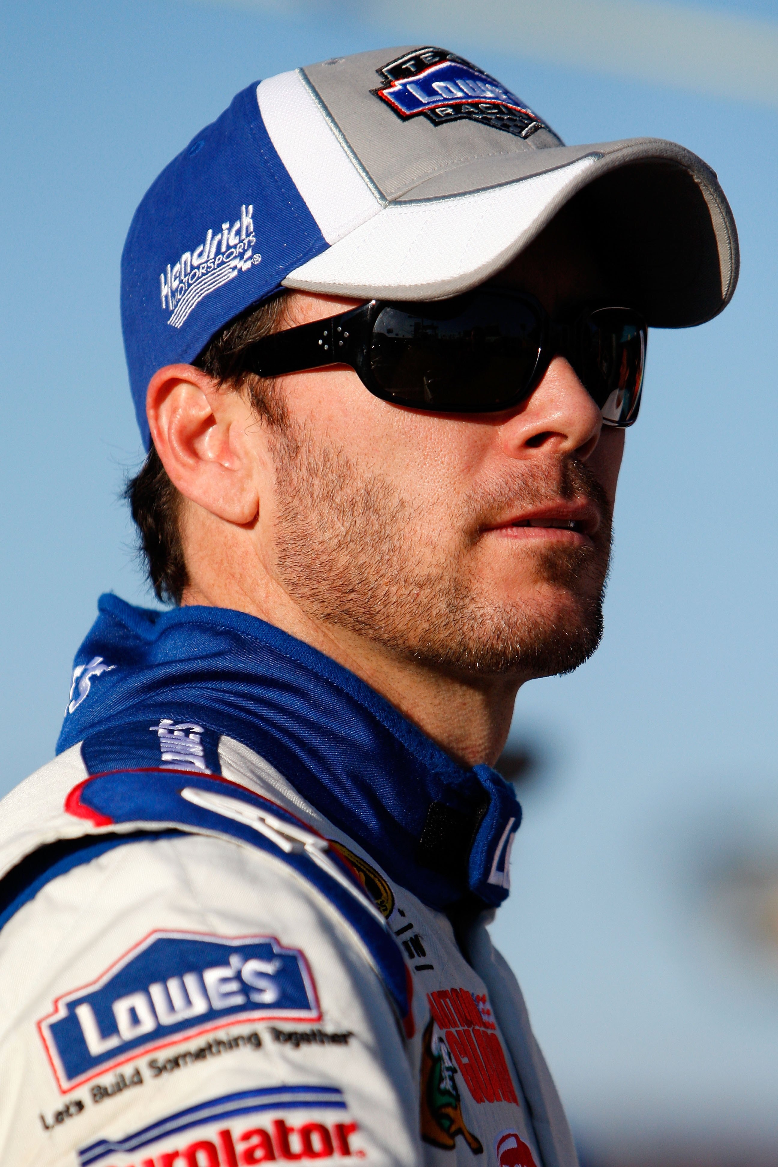 DAYTONA BEACH, FL - FEBRUARY 14:  Jimmie Johnson, driver of the #48 Lowe's Chevrolet, stands on pit road during a red flag stoppage due to track damage during the NASCAR Sprint Cup Series Daytona 500 at Daytona International Speedway on February 14, 2010
