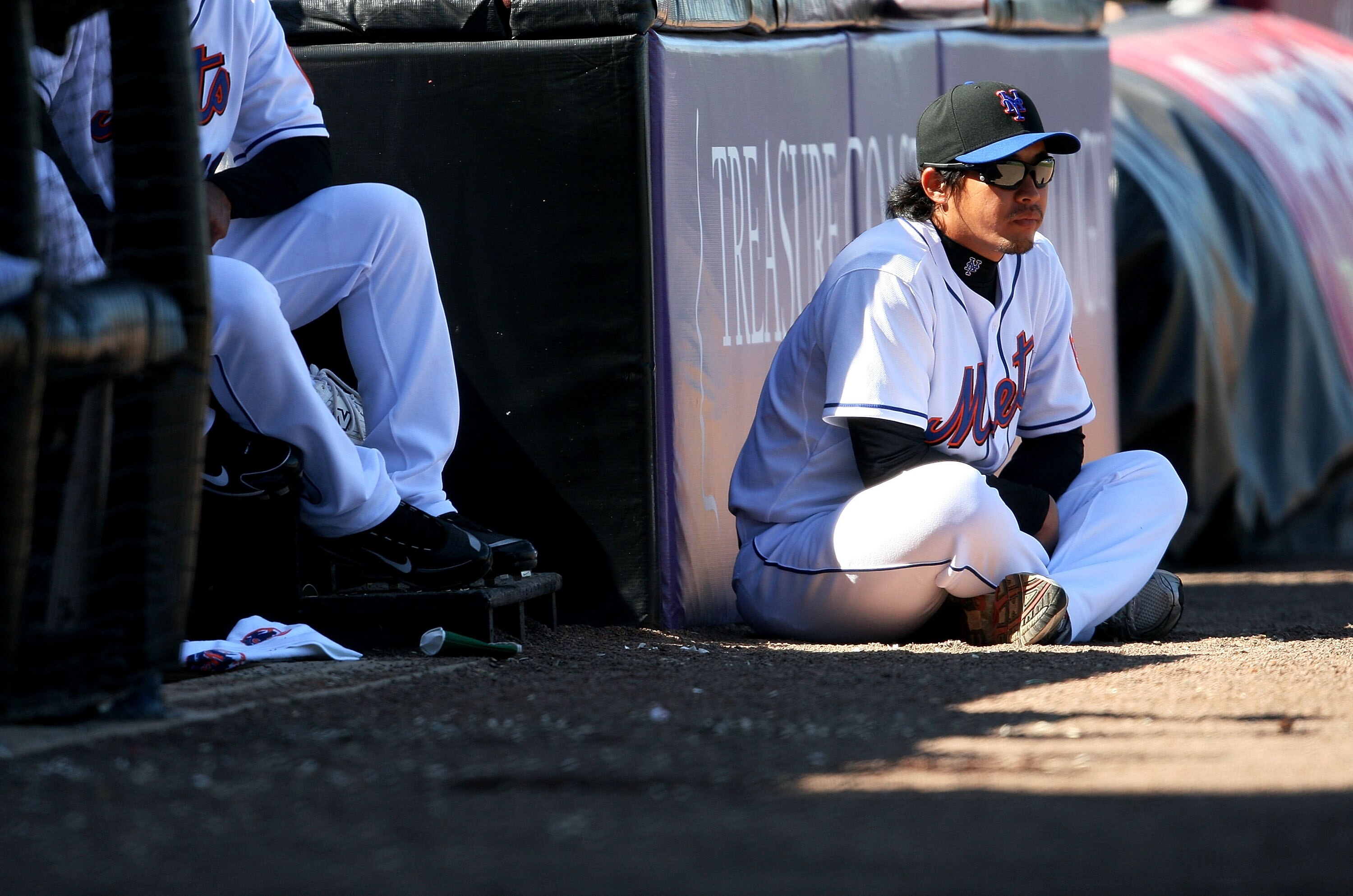 PORT ST. LUCIE, FL - MARCH 07:  Pitcher Ryota Igarashi #18 watches countryman and relief pitcher Hisanori Takahashi #47 of the New York Mets pitch against the Washington Nationals at Tradition Field on March 7, 2010 in Port St. Lucie, Florida.  (Photo by