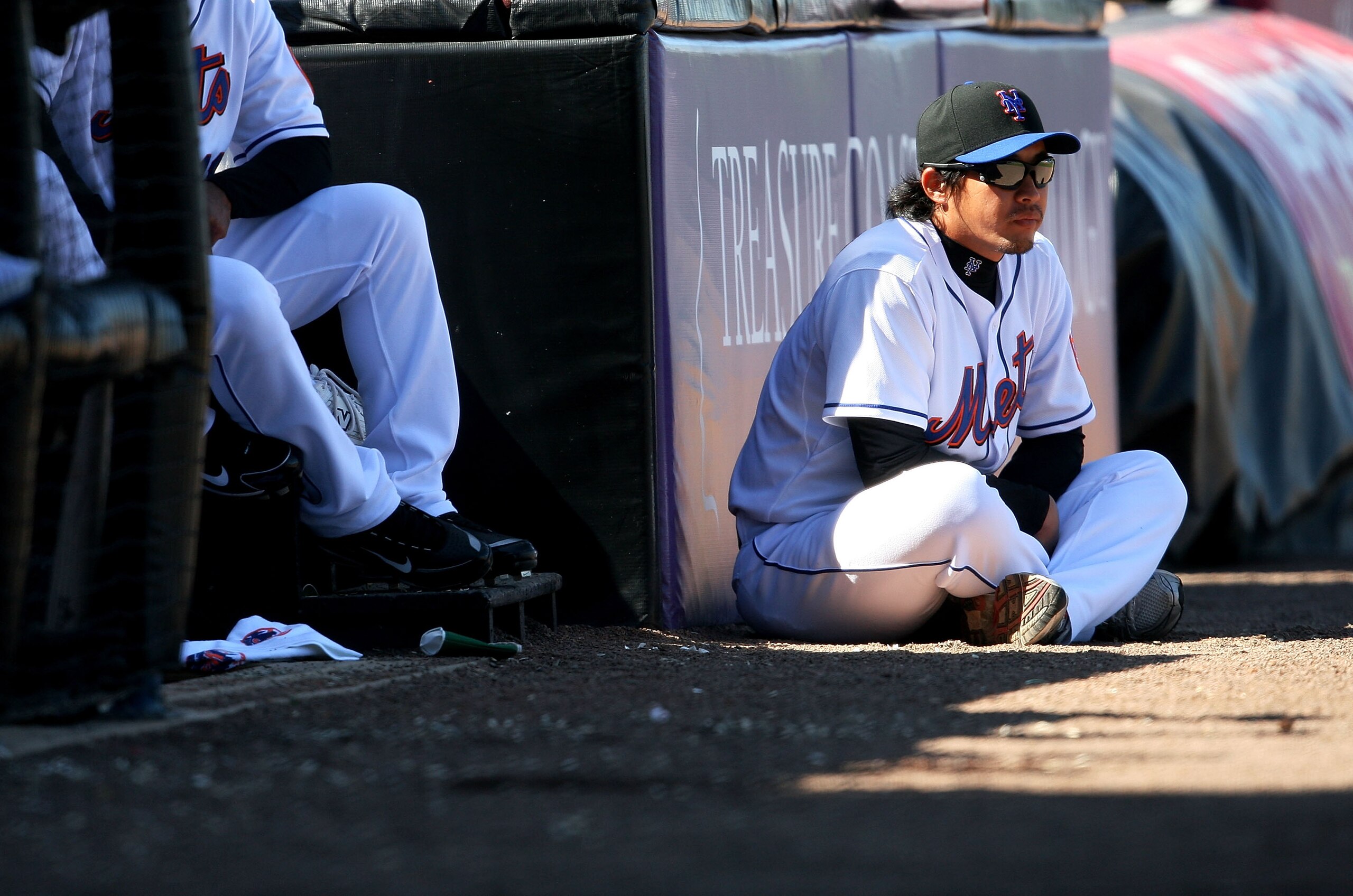 PORT ST. LUCIE, FL - MARCH 07:  Pitcher Ryota Igarashi #18 watches countryman and relief pitcher Hisanori Takahashi #47 of the New York Mets pitch against the Washington Nationals at Tradition Field on March 7, 2010 in Port St. Lucie, Florida.  (Photo by