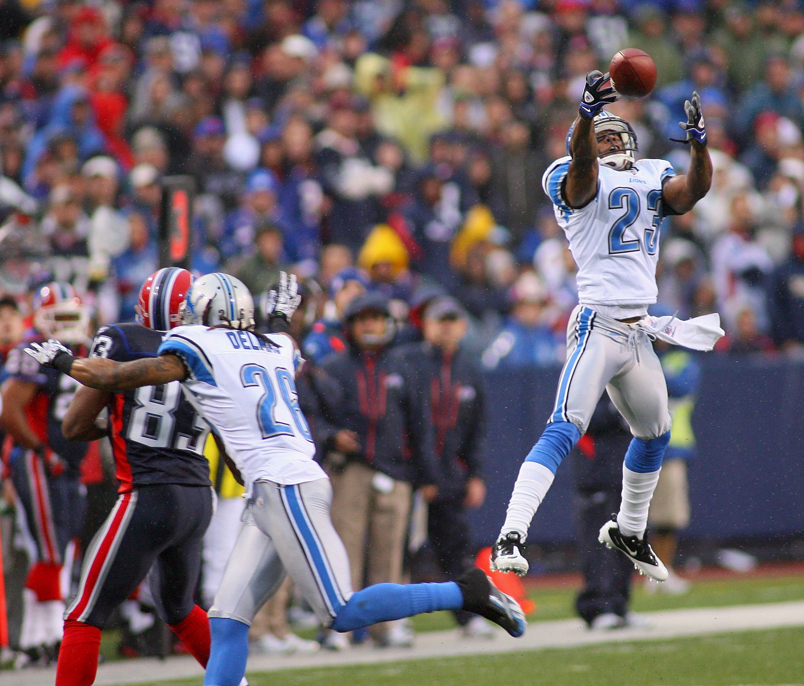 ORCHARD PARK, NY - NOVEMBER 14: Chris Houston #23 of the Detroit Lions unsuccesfully tries to intercept a pass intended for Lee Evans #83 of the Buffalo Bills  at Ralph Wilson Stadium on November 14, 2010 in Orchard Park, New York. Buffalo won 14-12. (Pho
