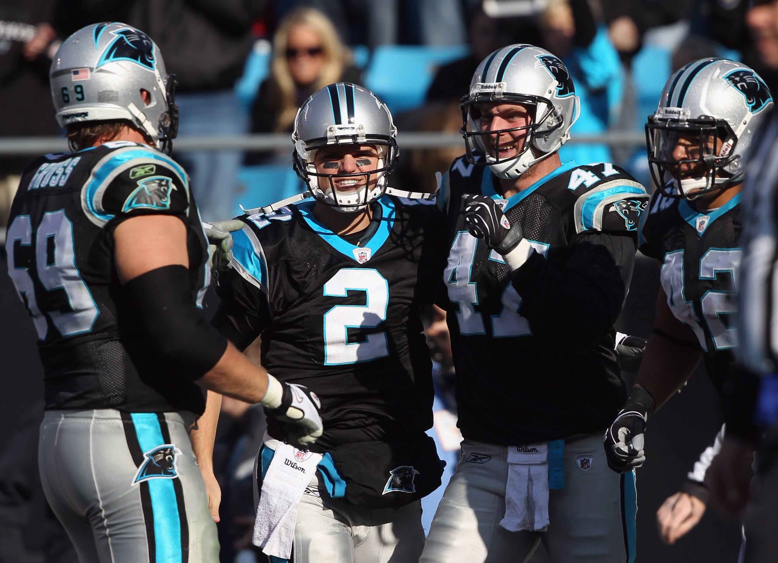 CHARLOTTE, NC - DECEMBER 19:  Teammates Jimmy Clausen #2 and Jeff King #47 of the Carolina Panthers celebrate after a touchdown by King during their game against the Arizona Cardinals at Bank of America Stadium on December 19, 2010 in Charlotte, North Car