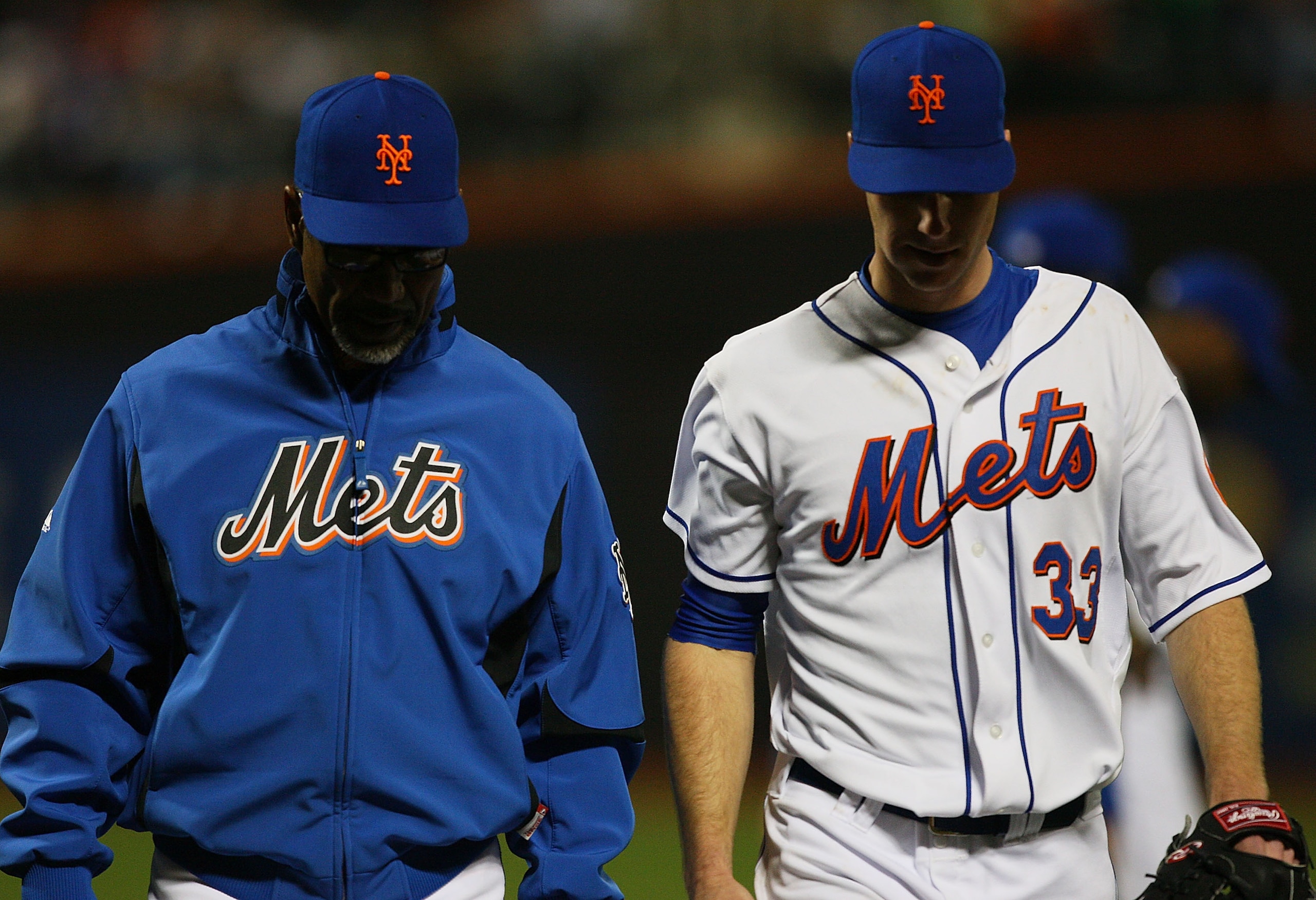 NEW YORK - APRIL 23:  Manager Jerry Manuel #53 of the New York Mets walks John Maine #33 off the field after suffering an injury in the forth inning against the Atlanta Braves on April 23, 2010 at Citi Field in the Flushing neighborhood of the Queens boro
