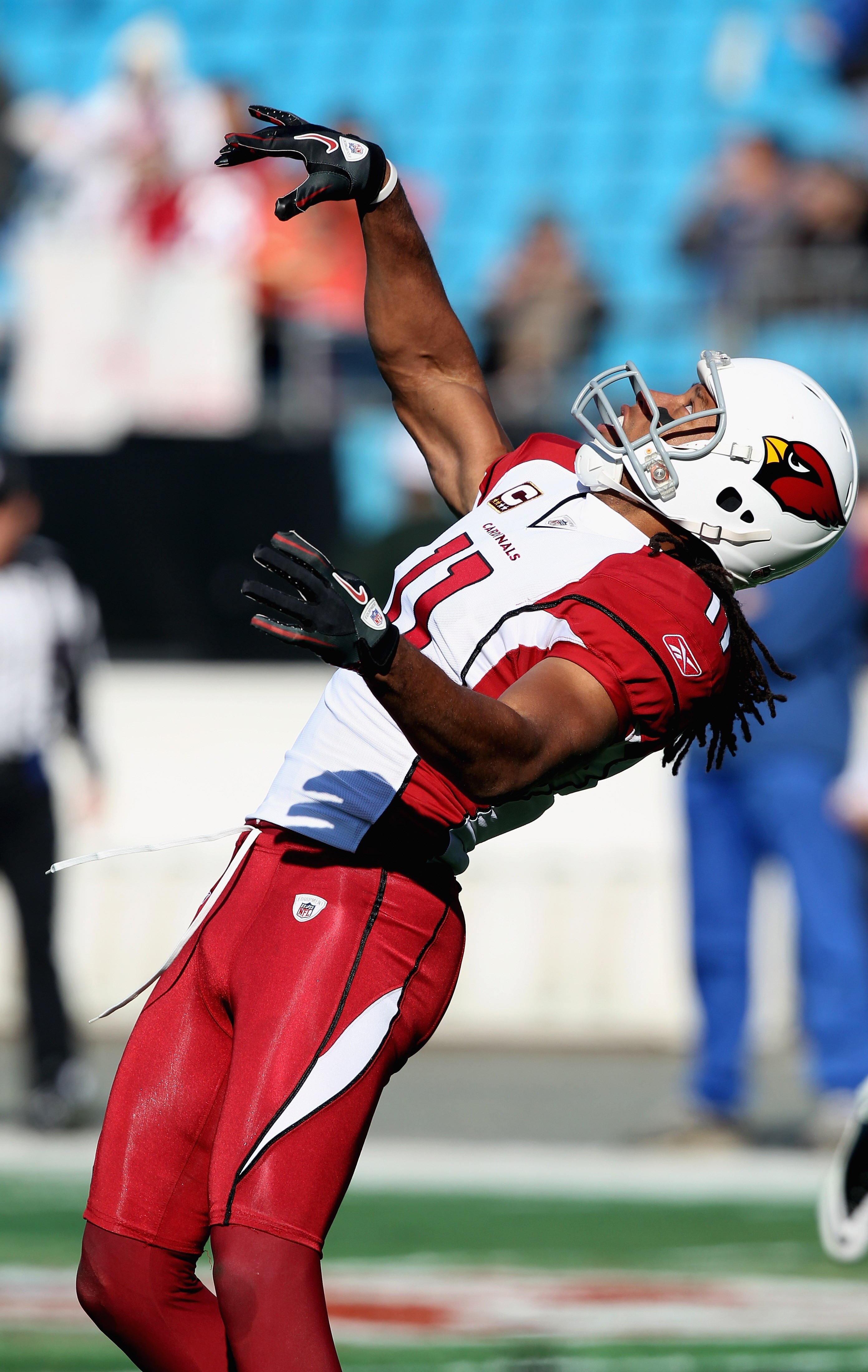 CHARLOTTE, NC - DECEMBER 19:  Larry Fitzgerald #11 of the Arizona Cardinals warms up before the start of their game against the Carolina Panthers at Bank of America Stadium on December 19, 2010 in Charlotte, North Carolina.  (Photo by Streeter Lecka/Getty