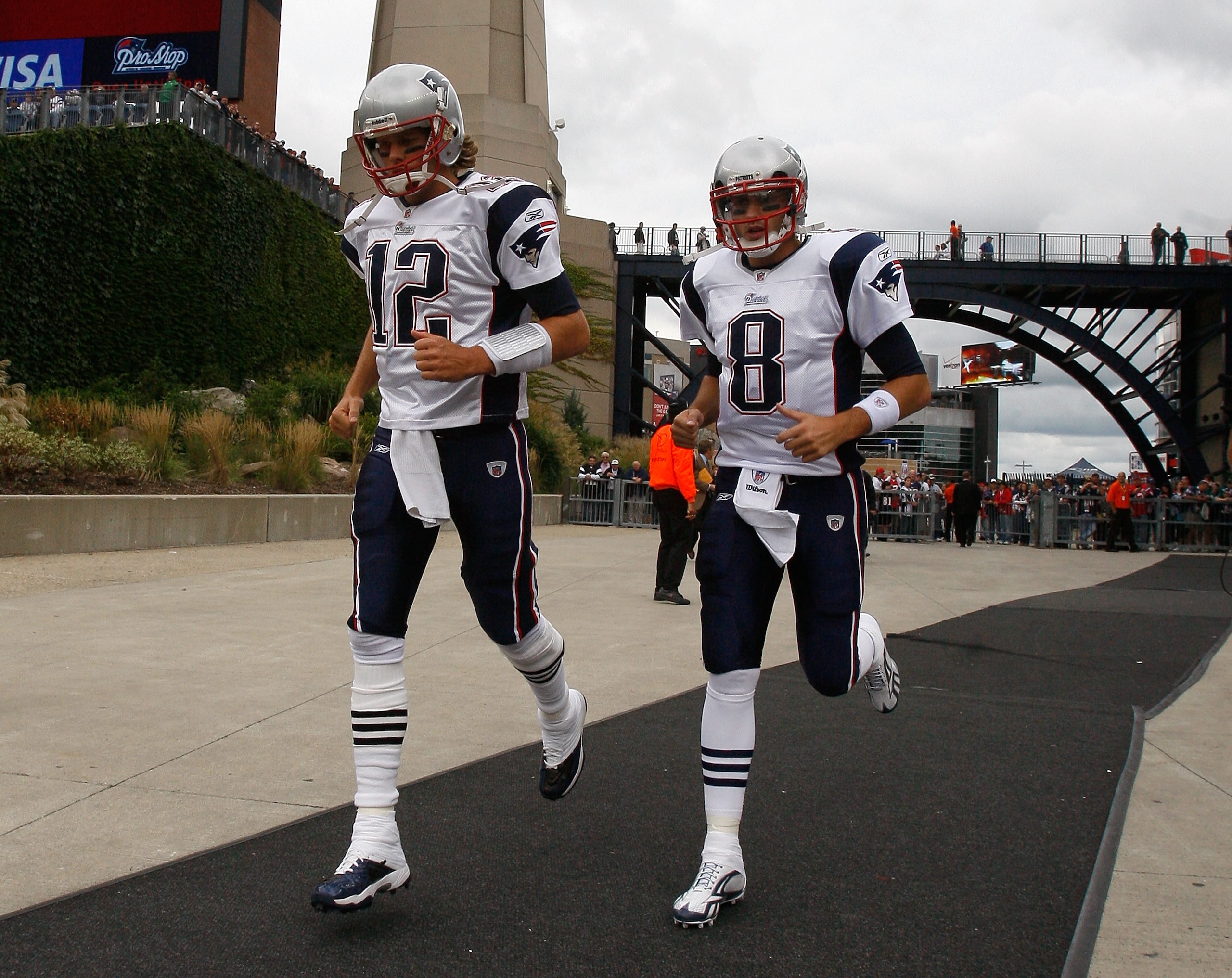 FOXBORO, MA - SEPTEMBER 12: Quarterbacks Tom Brady #12 and Brian Hoyer #8 of the New England Patriots run onto the field before the NFL season opener against the Cincinnati Bengals at Gillette Stadium on September 12, 2010 in Foxboro, Massachusetts. (Phot