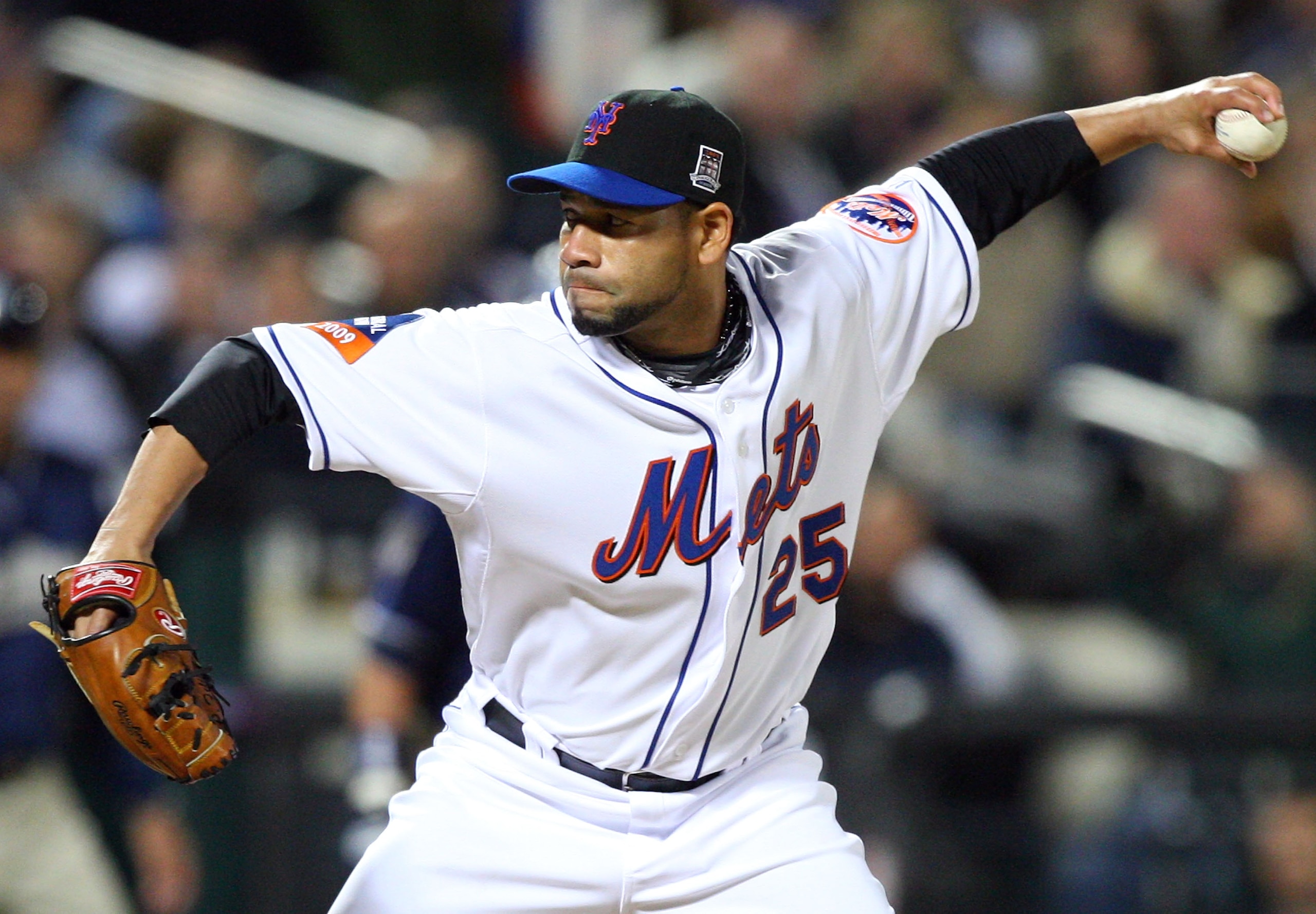NEW YORK - APRIL 13:  Pitcher Pedro Feliciano #25 of the New York Mets pitches in the sixth inning during opening day against  the San Diego Padres at Citi Field on April 13, 2009 in the Flushing neighborhood of the Queens borough of New York City. This i