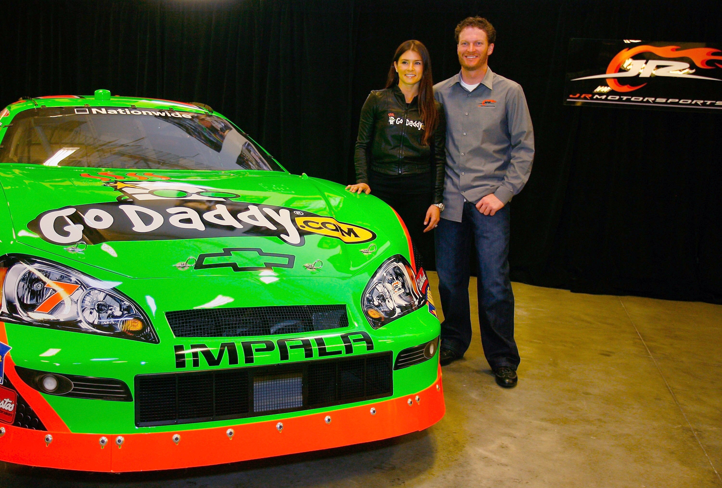 MOORESVILLE, NC - DECEMBER 17:  Danica Patrick (L), driver of the #7 GoDaddy.com Chevrolet poses with team owner Dale Earnhardt Jr. (R), at JR Motorsports on December 17, 2009 in Mooresville, North Carolina.  (Photo by Jason Smith/Getty Images)