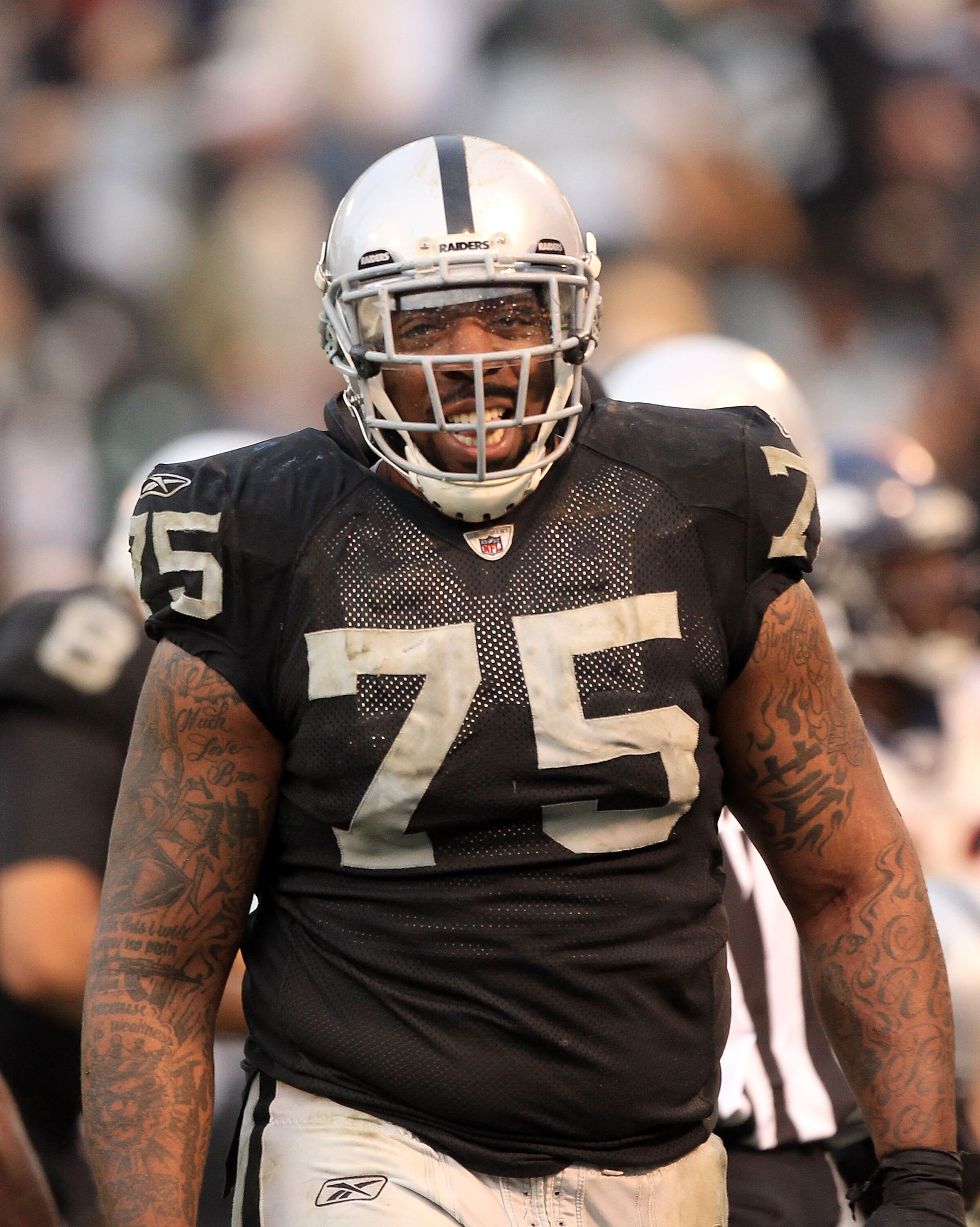 OAKLAND, CA - DECEMBER 19:  Mario Henderson #75 of the Oakland Raiders smiles during their game against the Denver Broncos at Oakland-Alameda County Coliseum on December 19, 2010 in Oakland, California.  (Photo by Ezra Shaw/Getty Images)
