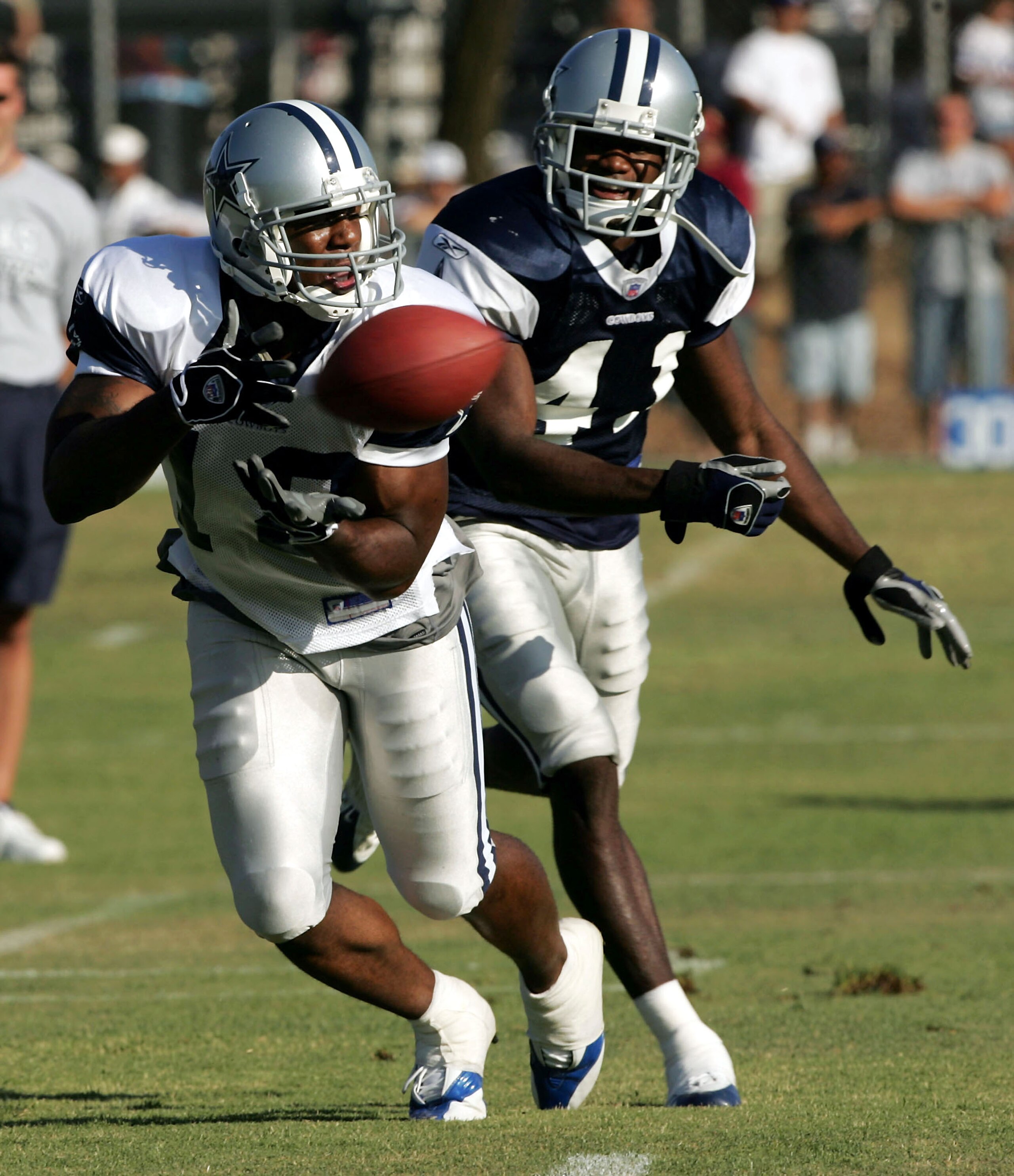 OXNARD, CA - JULY 30: Wide receiver Terrance Copper #18 of the Dallas Cowboys makes a catch in front of defensive back Terence Newman #41 during the first day of training camp on July 30, 2005 in Oxnard, California.  (Photo by Stephen Dunn /Getty Images)