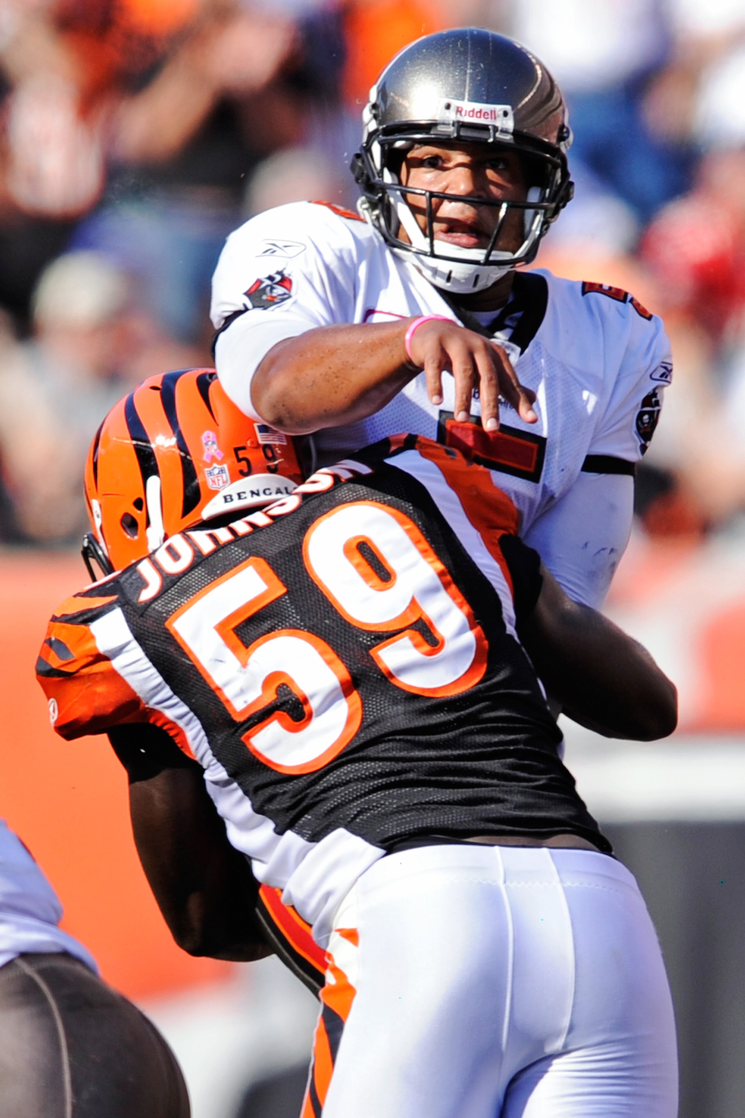 CINCINNATI, OH - OCTOBER 10:  Quarterback Josh Freeman #5 of the Tampa Bay Buccaneers is hit by Brandon Johnson #59 of the Cincinnati Bengals just as he releases the ball at Paul Brown Stadium on October 10, 2010 in Cincinnati, Ohio.  (Photo by Jamie Saba