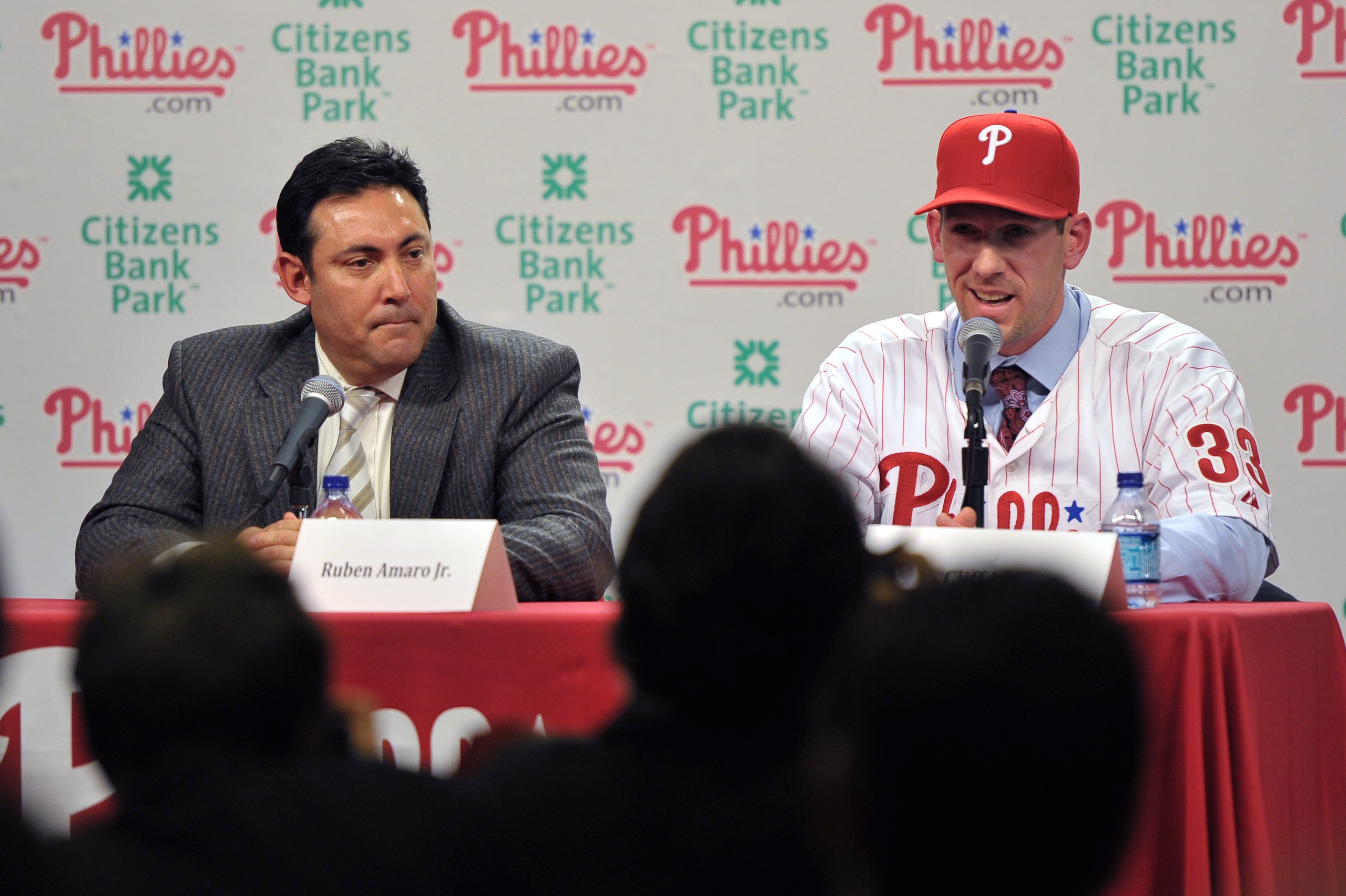 PHILADELPHIA - DECEMBER 15: Pitcher Cliff Lee #33 of the Philadelphia Phillies talks with the media while general manager Ruben Amaro Jr. (L) watches during a press conference at Citizens Bank Park on December 15, 2010 in Philadelphia, Pennsylvania. (Phot