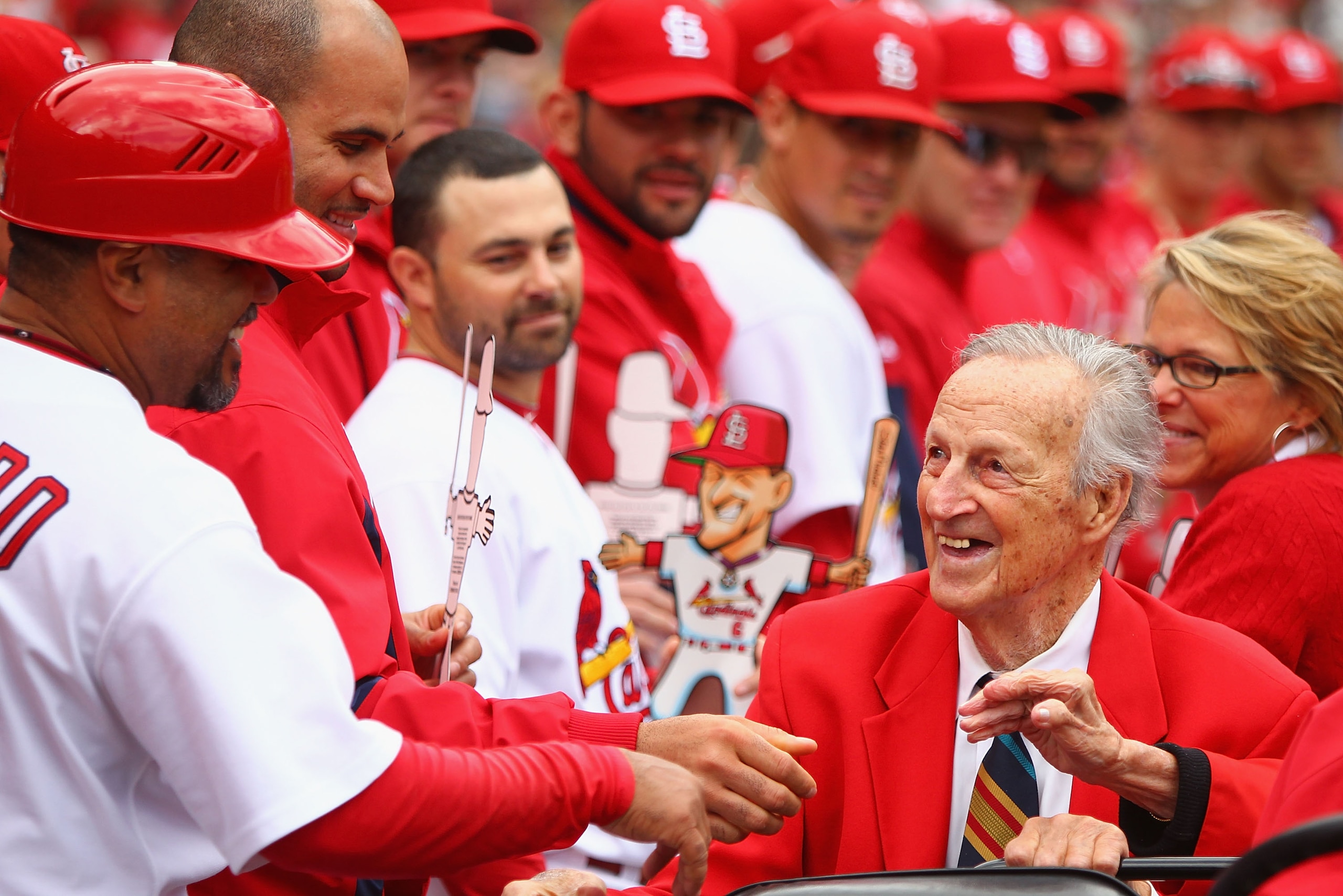 ST. LOUIS - OCTOBER 2: Former St. Louis Cardinals player Stan Musial greets members of the St. Louis Cardinals in between innings against the Colorado Rockies at Busch Stadium on October 2, 2010 in St. Louis, Missouri.  The Cardinals beat the Rockies 1-0