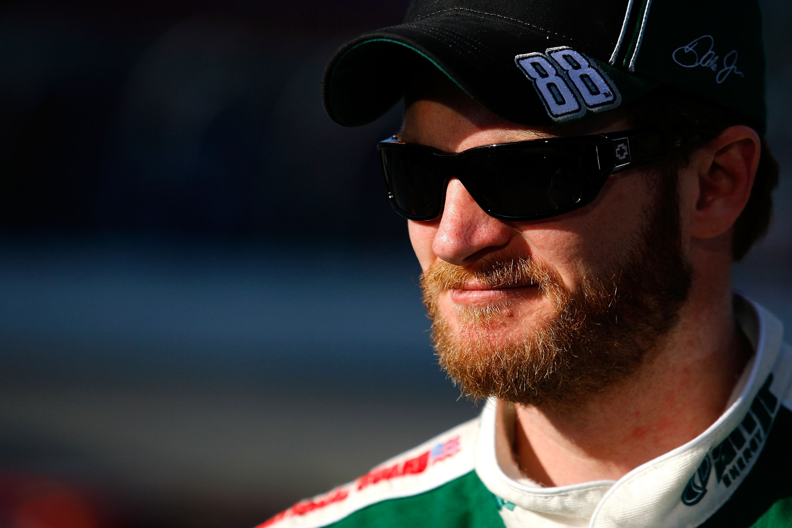 DAYTONA BEACH, FL - FEBRUARY 14:  Dale Earnhardt Jr., driver of the #88 AMP Energy/National Guard Chevrolet, stands on pit row during a red flag stoppage due to track damage during the NASCAR Sprint Cup Series Daytona 500 at Daytona International Speedway