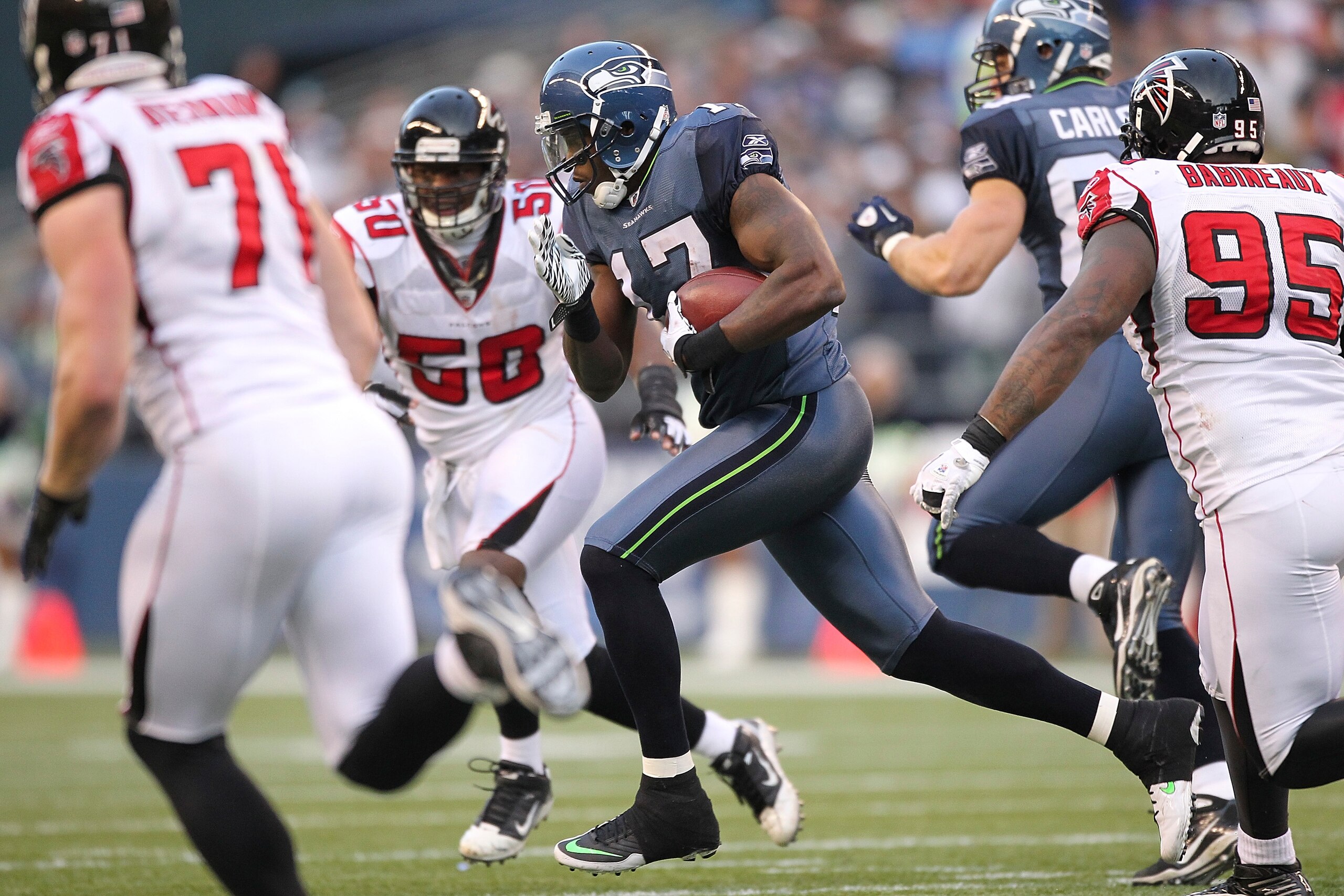 SEATTLE, WA - DECEMBER 19:  Wide receiver Mike Williams #17 of the Seattle Seahawks rushes against the Atlanta Falcons at Qwest Field on December 19, 2010 in Seattle, Washington. The Falcons defeated the Seahawks 34-18. (Photo by Otto Greule Jr/Getty Imag