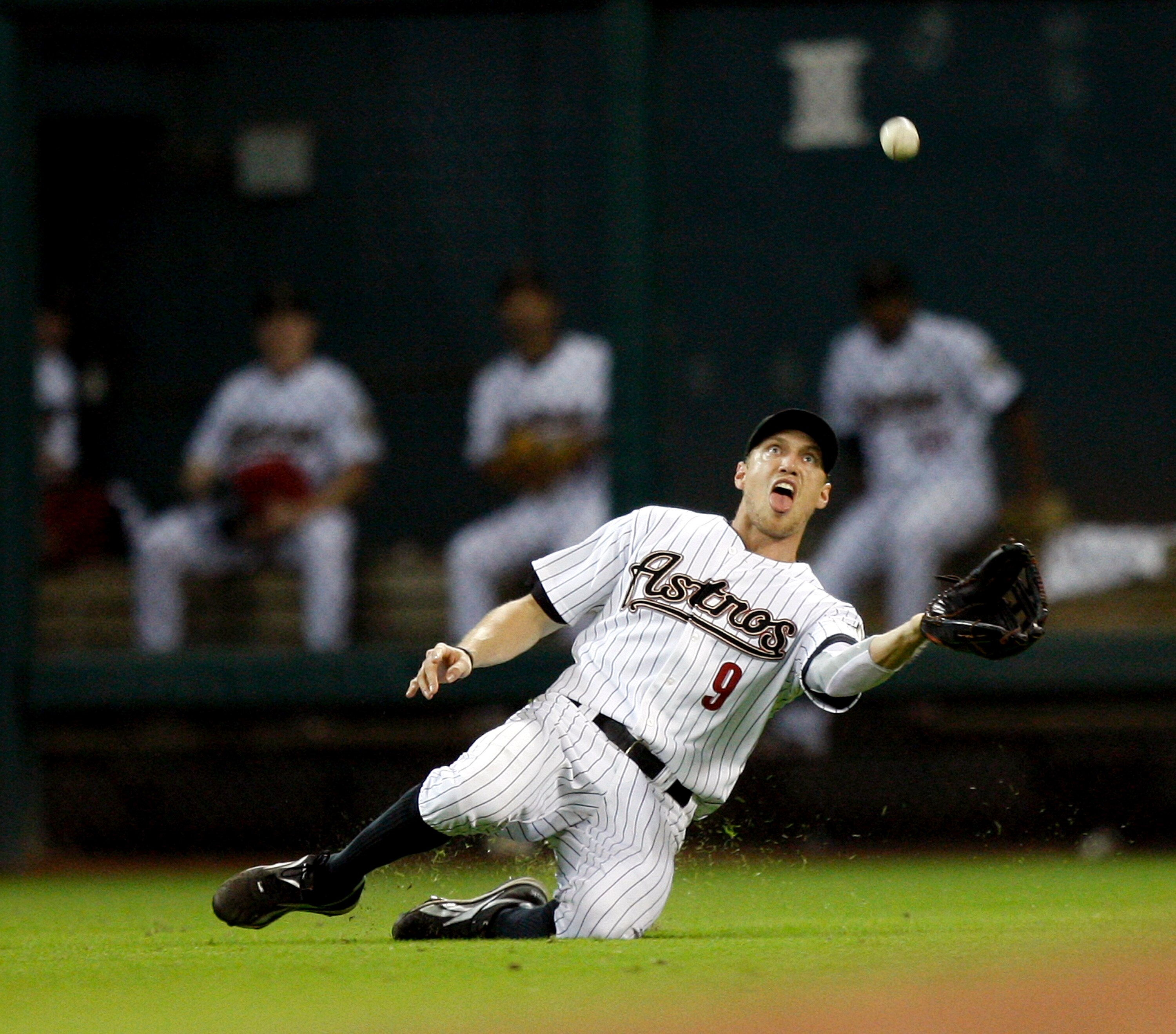 HOUSTON - AUGUST 19:  Left fielder Hunter Pence #9 of the Houston Astros makes a sliding save on a short fly ball hit by Jeff Francoeur of the New York Mets at Minute Maid Park on August 19, 2010 in Houston, Texas. Houston won 3-2.  (Photo by Bob Levey/Ge