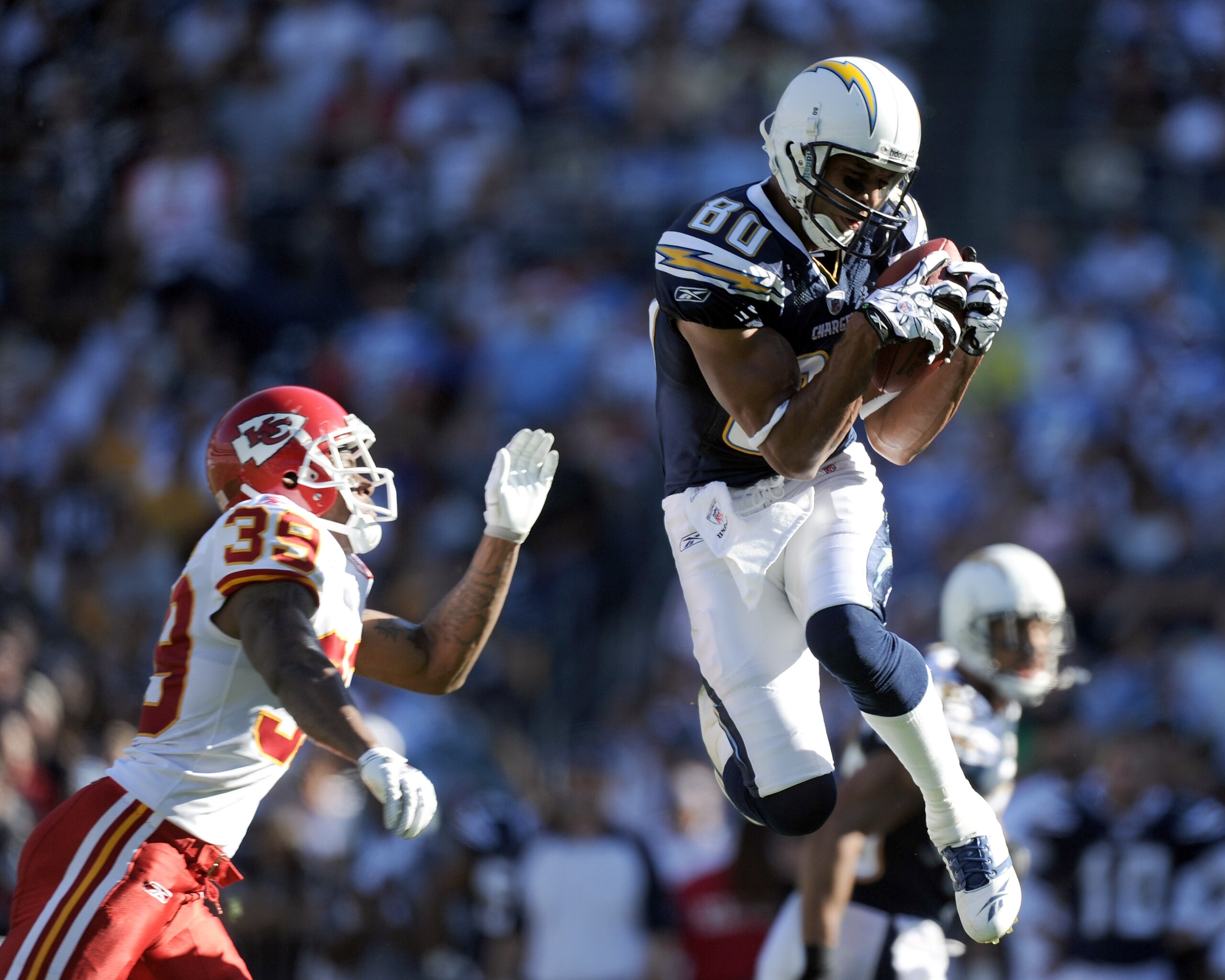 SAN DIEGO, CA - DECEMBER 12:  Malcom Floyd #80 of the San Diego Chargers makes a catch in front of Brandon Carr #39 of the Kansas City Chiefs during the first quarter at Qualcomm Stadium on December 12, 2010 in San Diego, California.  (Photo by Harry How/