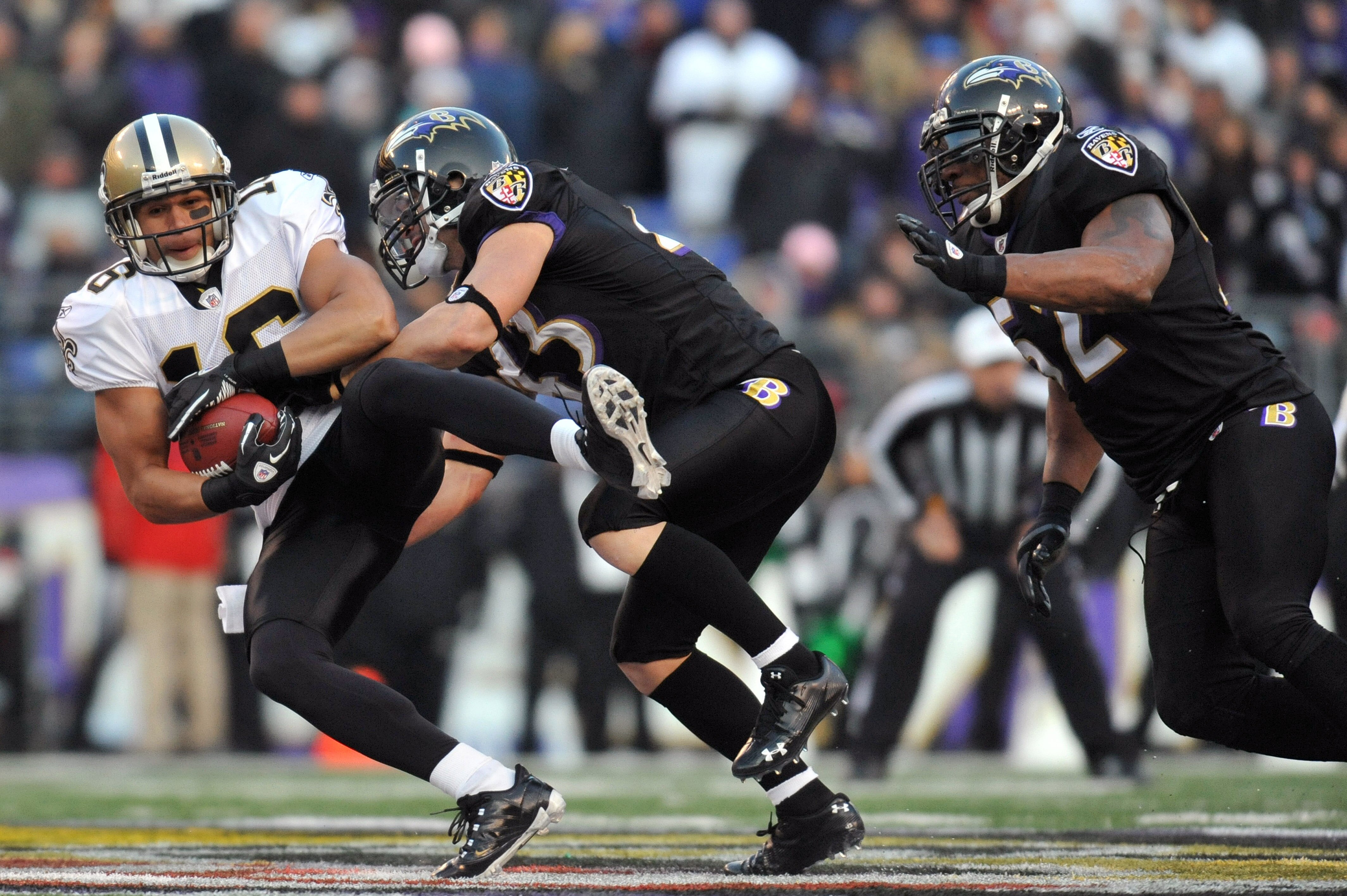 BALTIMORE, MD - DECEMBER 19:  Lance Moore #16 of the New Orleans Saints is tackled by Haruki Nakamura #43 of the Baltimore Ravens  at M&T Bank Stadium on December 19, 2010 in Baltimore, Maryland. The Ravens defeated the Saints 30-24. (Photo by Larry Frenc