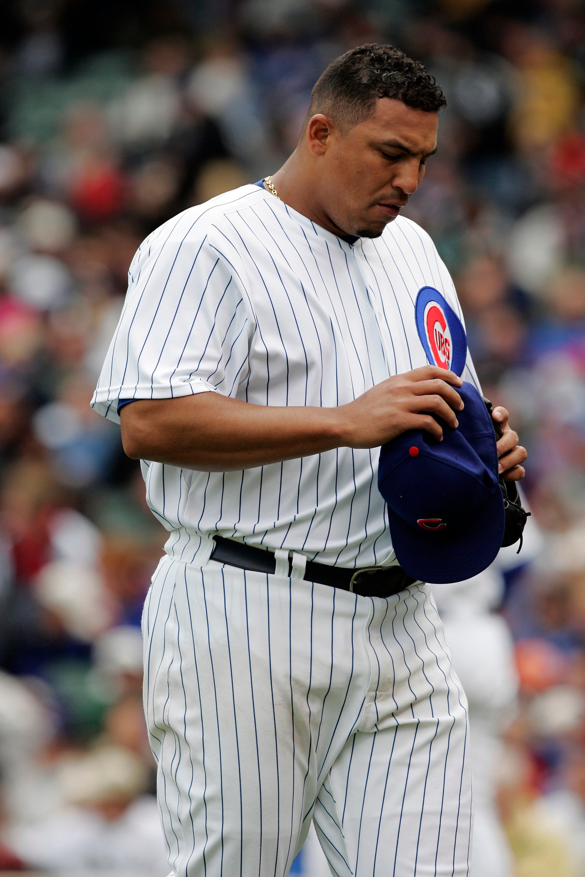CHICAGO - MAY 20:  Carlos Zambrano #38 of the Chicago Cubs heads to the dugout in a loss to the Chicago White Sox at Wrigley Field May 20, 2007 in Chicago, Illinois. The Sox won 10-6.  (Photo by Brian Bahr/Getty Images)