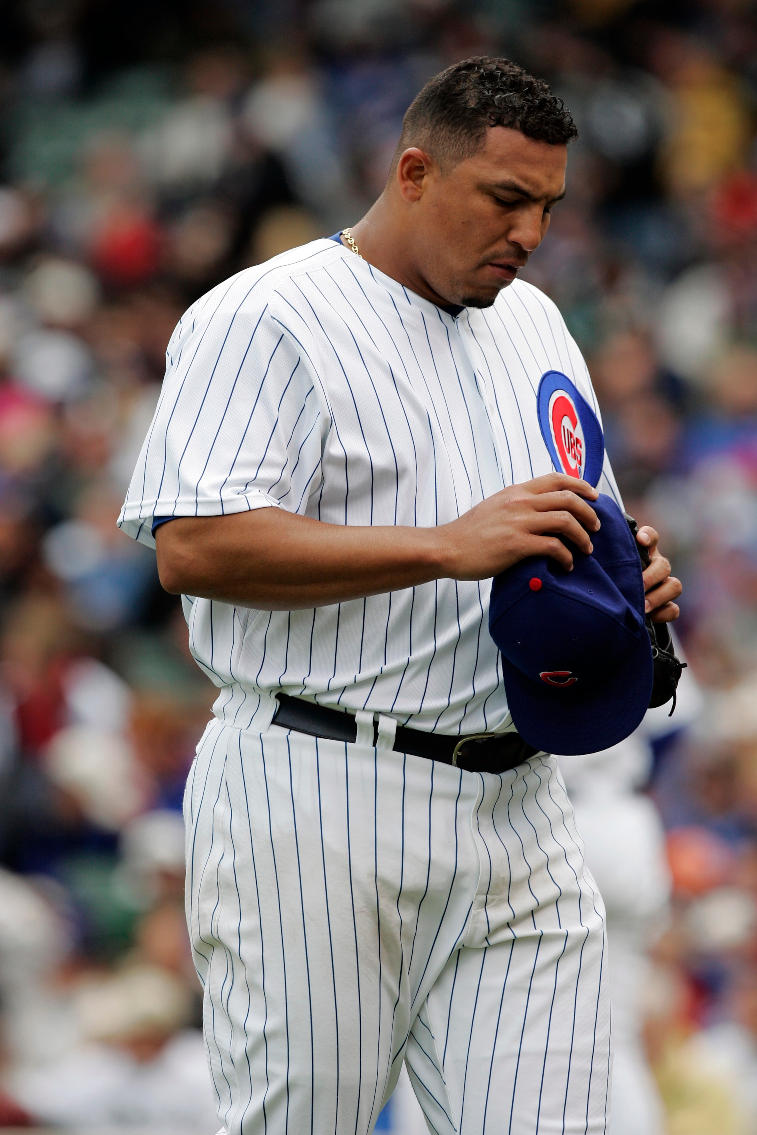 CHICAGO - MAY 20:  Carlos Zambrano #38 of the Chicago Cubs heads to the dugout in a loss to the Chicago White Sox at Wrigley Field May 20, 2007 in Chicago, Illinois. The Sox won 10-6.  (Photo by Brian Bahr/Getty Images)