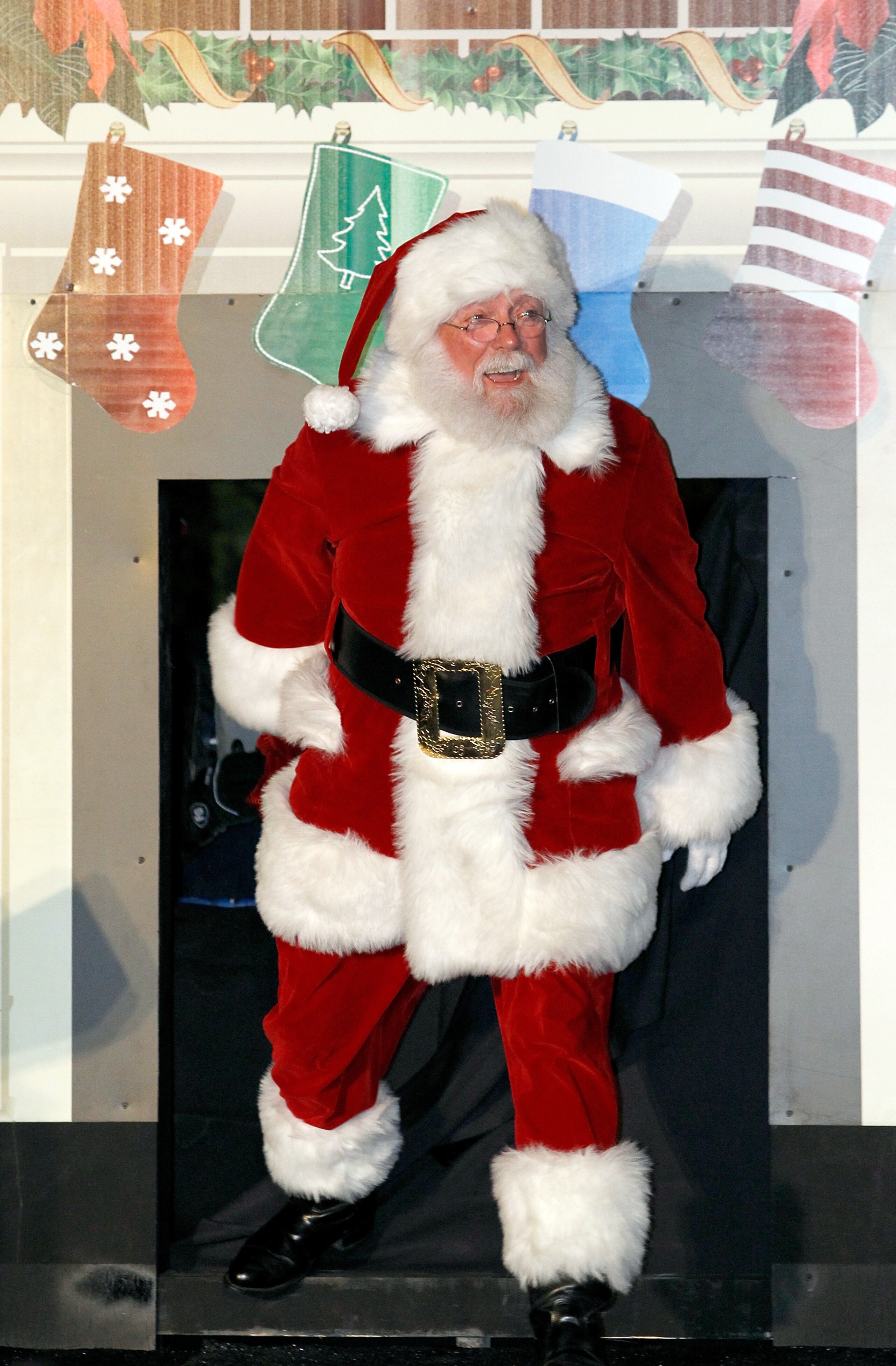 FORT WORTH, TX - DECEMBER 07:  Santa Clause arrives on stage during the Christmas tree lighting event at Texas Motor Speedway on December 7, 2010 in Fort Worth, Texas.  Speedway Childrens Charities, Chalmer McWilliams and Texas Air Systems provided 100 ch