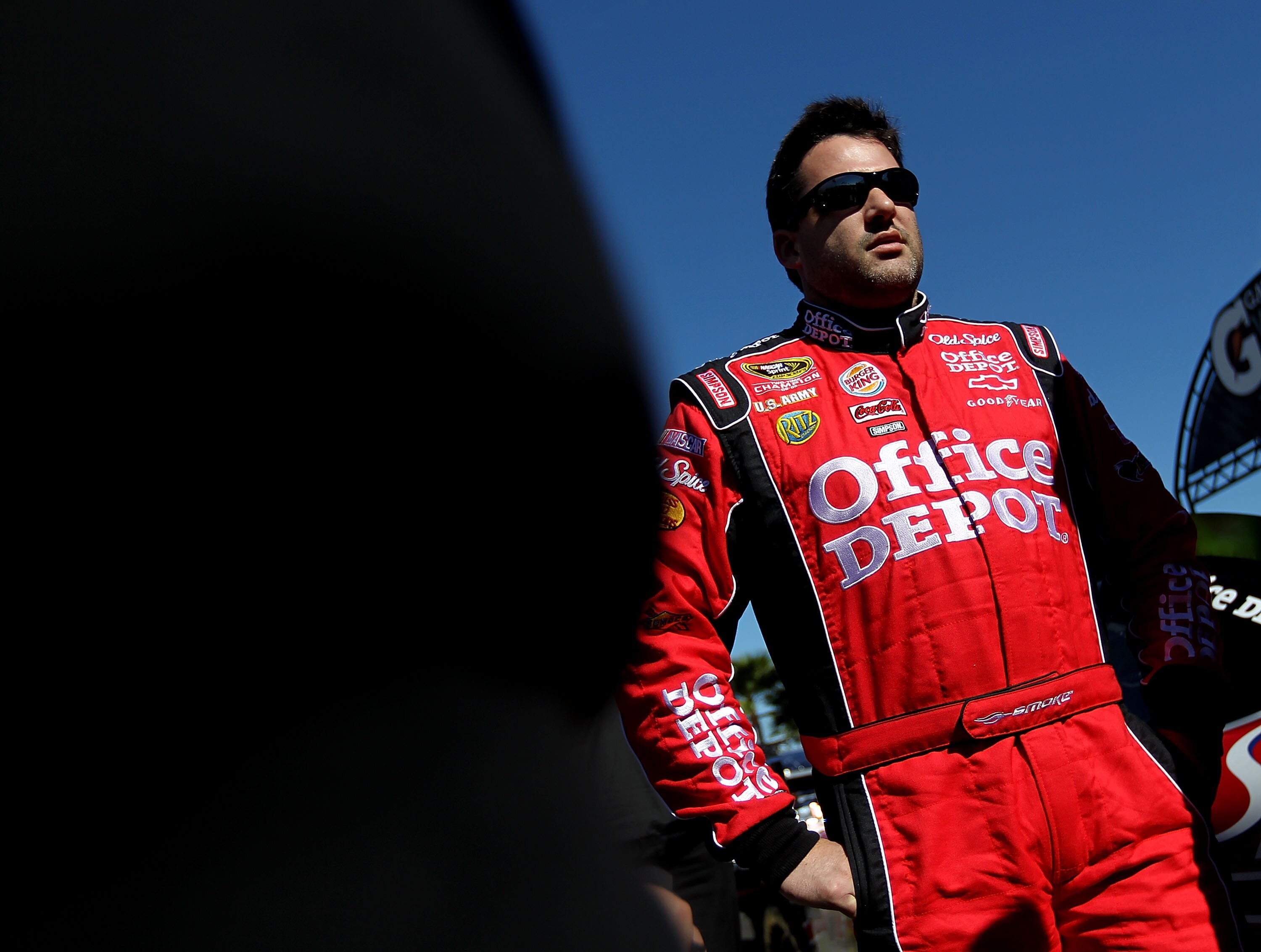 DAYTONA BEACH, FL - FEBRUARY 06:  Tony Stewart, driver of the #14 Office Depot Chevrolet, walks on pit road during qualifying for the Daytona 500 at Daytona International Speedway on February 6, 2010 in Daytona Beach, Florida.  (Photo by Nick Laham/Getty