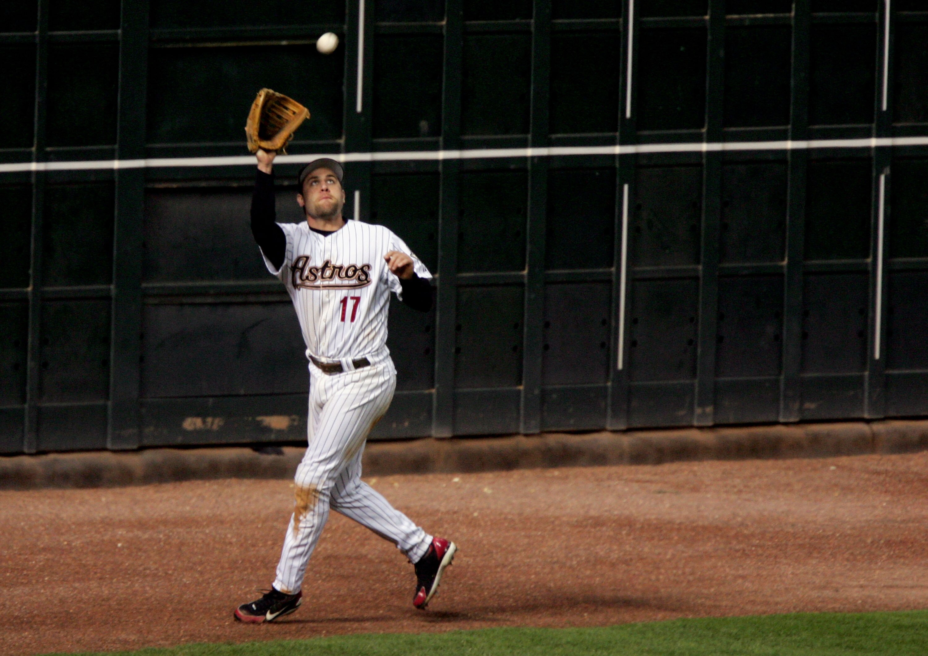 HOUSTON - OCTOBER 25:  Lance Berkman #17 of the Houston Astros catches a fly ball hit by the Chicago White Sox during Game Three of the 2005 Major League Baseball World Series at Minute Maid Park on October 25, 2005 in Houston, Texas.  (Photo by Jed Jacob