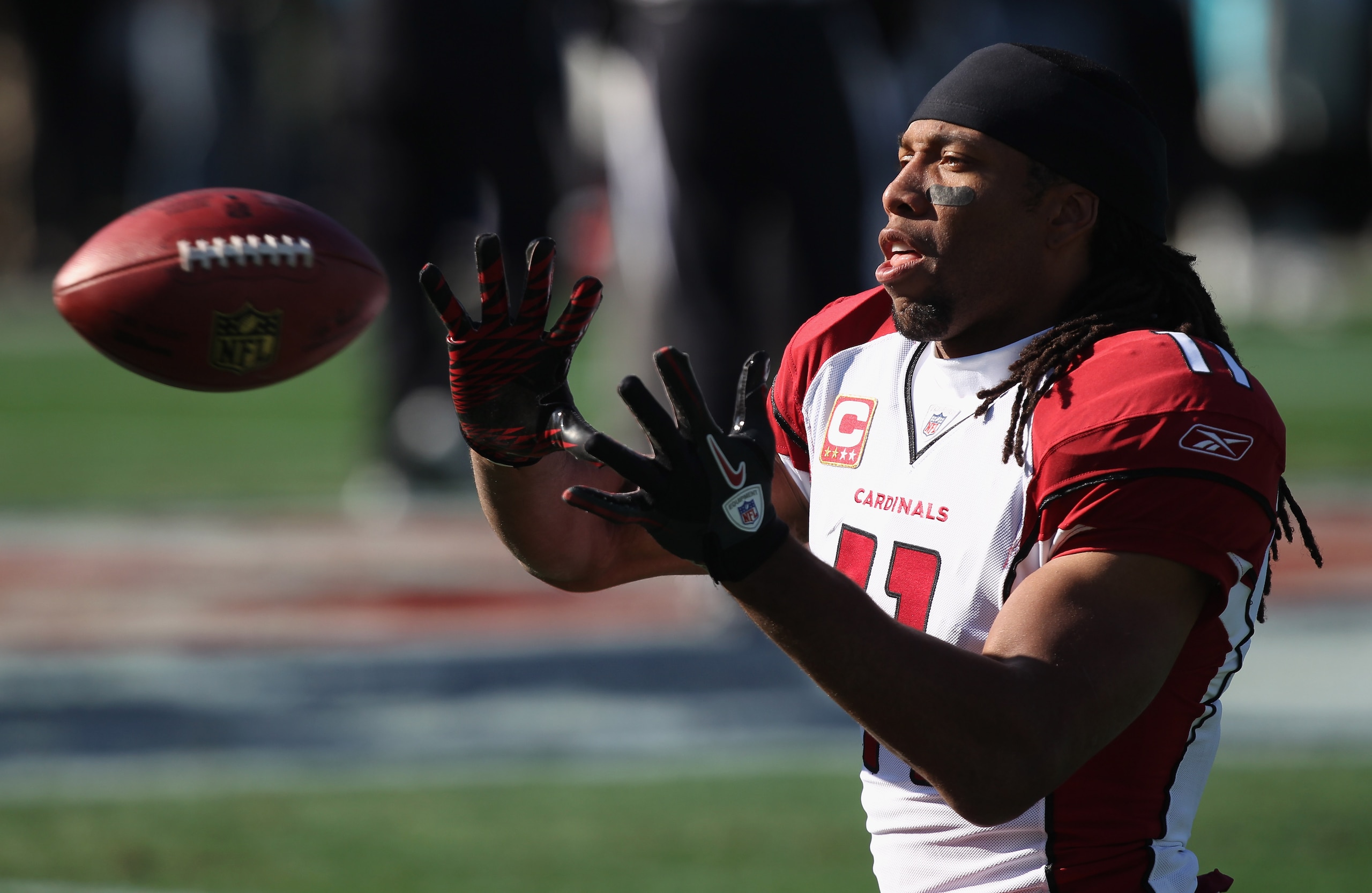 CHARLOTTE, NC - DECEMBER 19: Larry Fitzgerald #11 of the Arizona Cardinals warms up before the start of their game against the Carolina Panthers at Bank of America Stadium on December 19, 2010 in Charlotte, North Carolina. (Photo by Streeter Lecka/Getty CHARLOTTE, NC - DECEMBER 19: Larry Fitzgerald #11 of the Arizona Cardinals warms up before the start of their game against the Carolina Panthers at Bank of America Stadium on December 19, 2010 in Charlotte, North Carolina. (Photo by Streeter Lecka/Getty