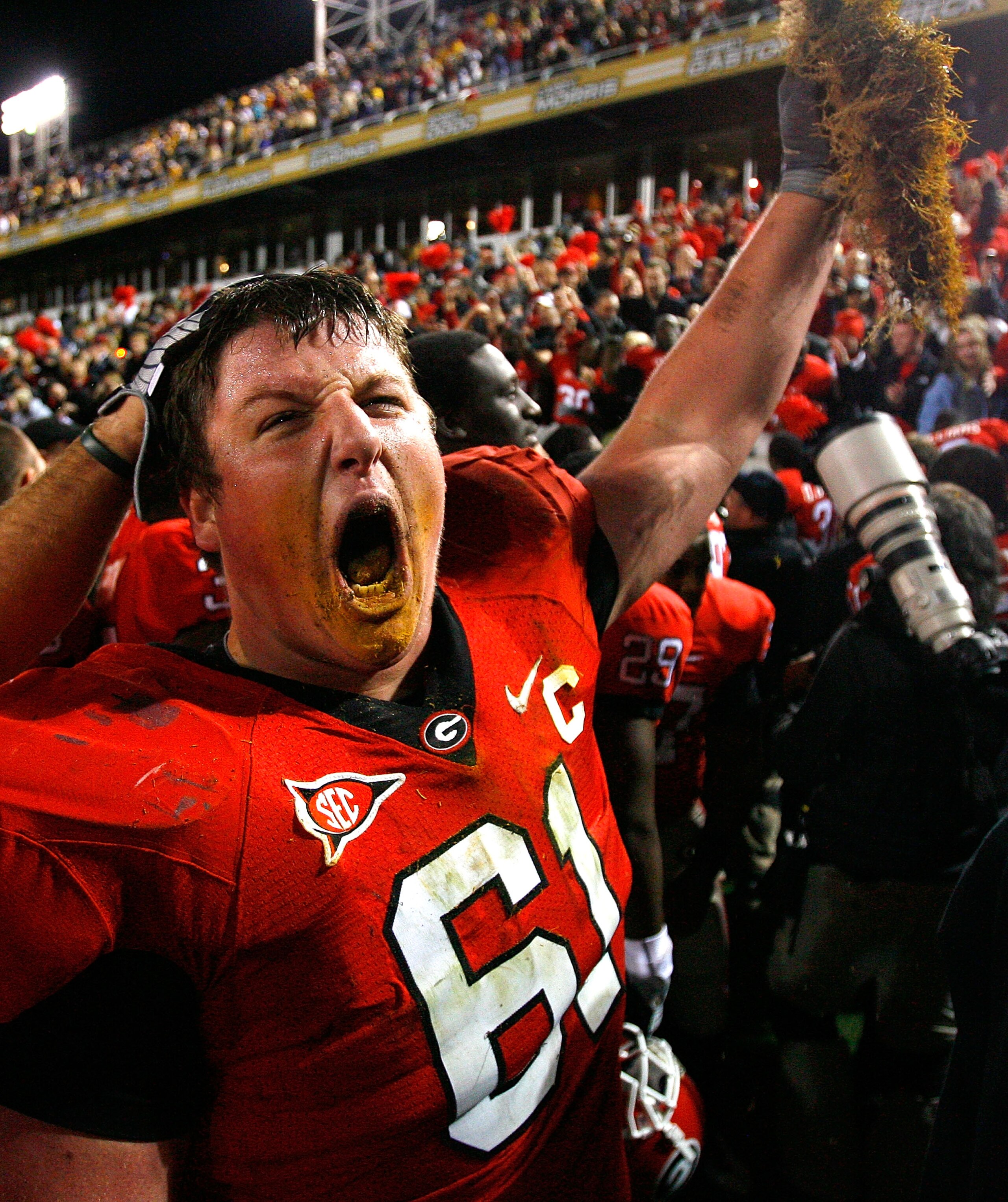 ATLANTA - NOVEMBER 28: Ben Jones #61 of the Georgia Bulldogs celebrates their 30-24 win over the Georgia Tech Yellow Jackets with a some grass from the end zone at Bobby Dodd Stadium on November 28, 2009 in Atlanta, Georgia. (Photo by Kevin C. Cox/Getty ATLANTA - NOVEMBER 28: Ben Jones #61 of the Georgia Bulldogs celebrates their 30-24 win over the Georgia Tech Yellow Jackets with a some grass from the end zone at Bobby Dodd Stadium on November 28, 2009 in Atlanta, Georgia. (Photo by Kevin C. Cox/Getty