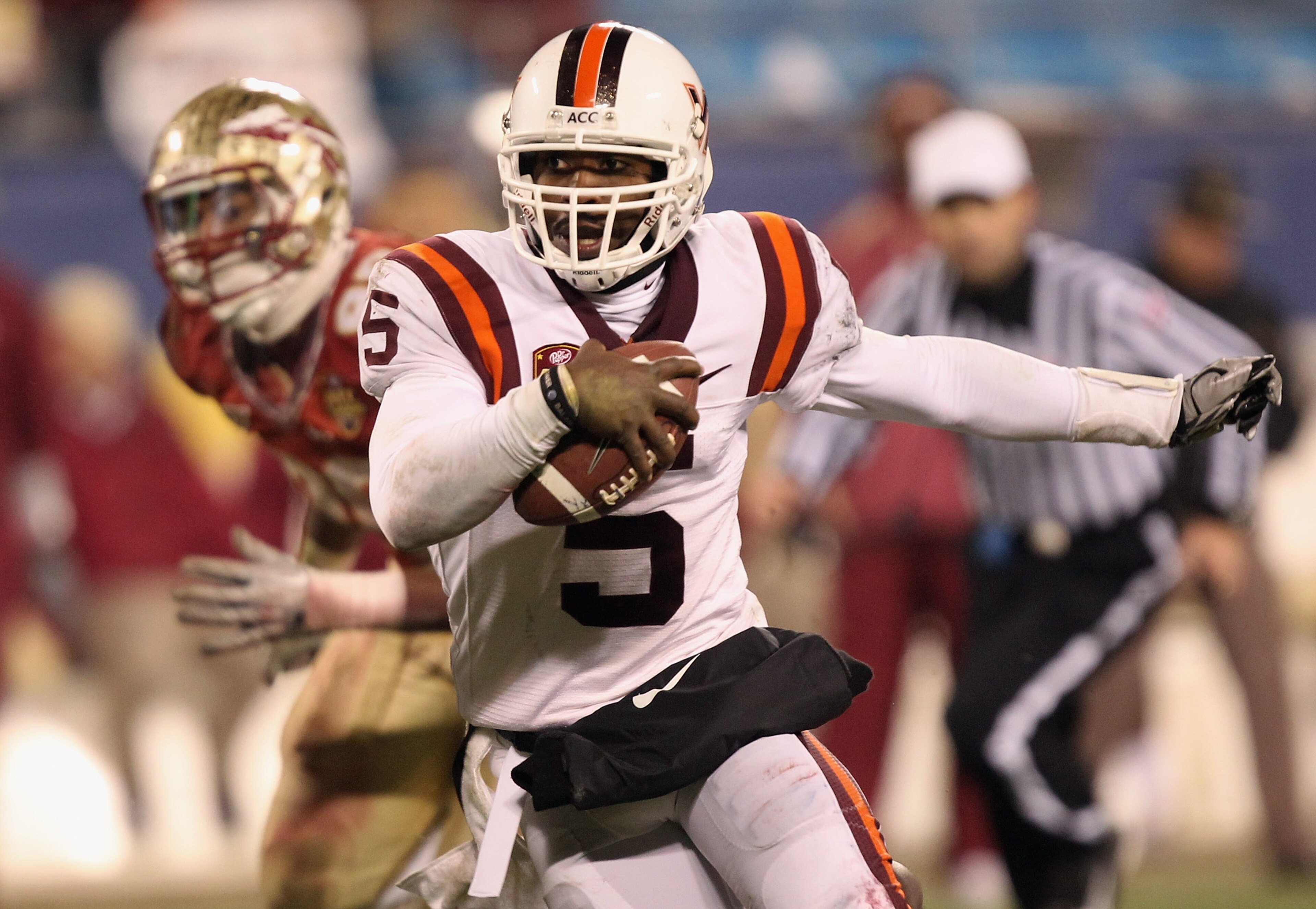 CHARLOTTE, NC - DECEMBER 04:  Tyrod Taylor #5 of the Virginia Tech Hokies runs with the ball against the Florida State Seminoles during their game at Bank of America Stadium on December 4, 2010 in Charlotte, North Carolina.  (Photo by Streeter Lecka/Getty