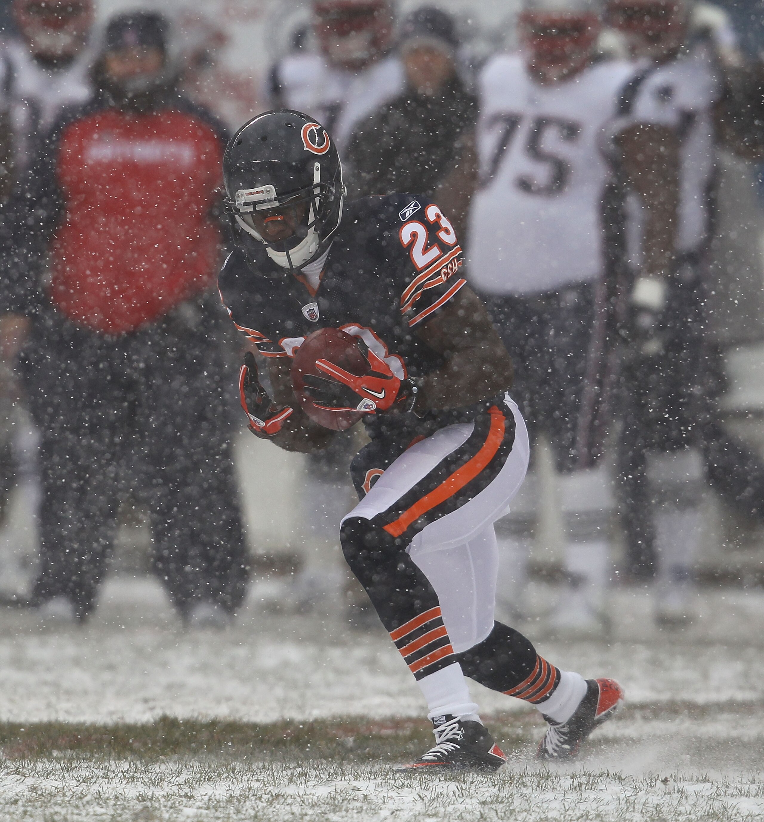CHICAGO, IL - DECEMBER 12: Devin Hester #23 of the Chicago Bears fields a punt against the New England Patriots at Soldier Field on December 12, 2010 in Chicago, Illinois. The Patriots defeated the Bears 36-7. (Photo by Jonathan Daniel/Getty Images)