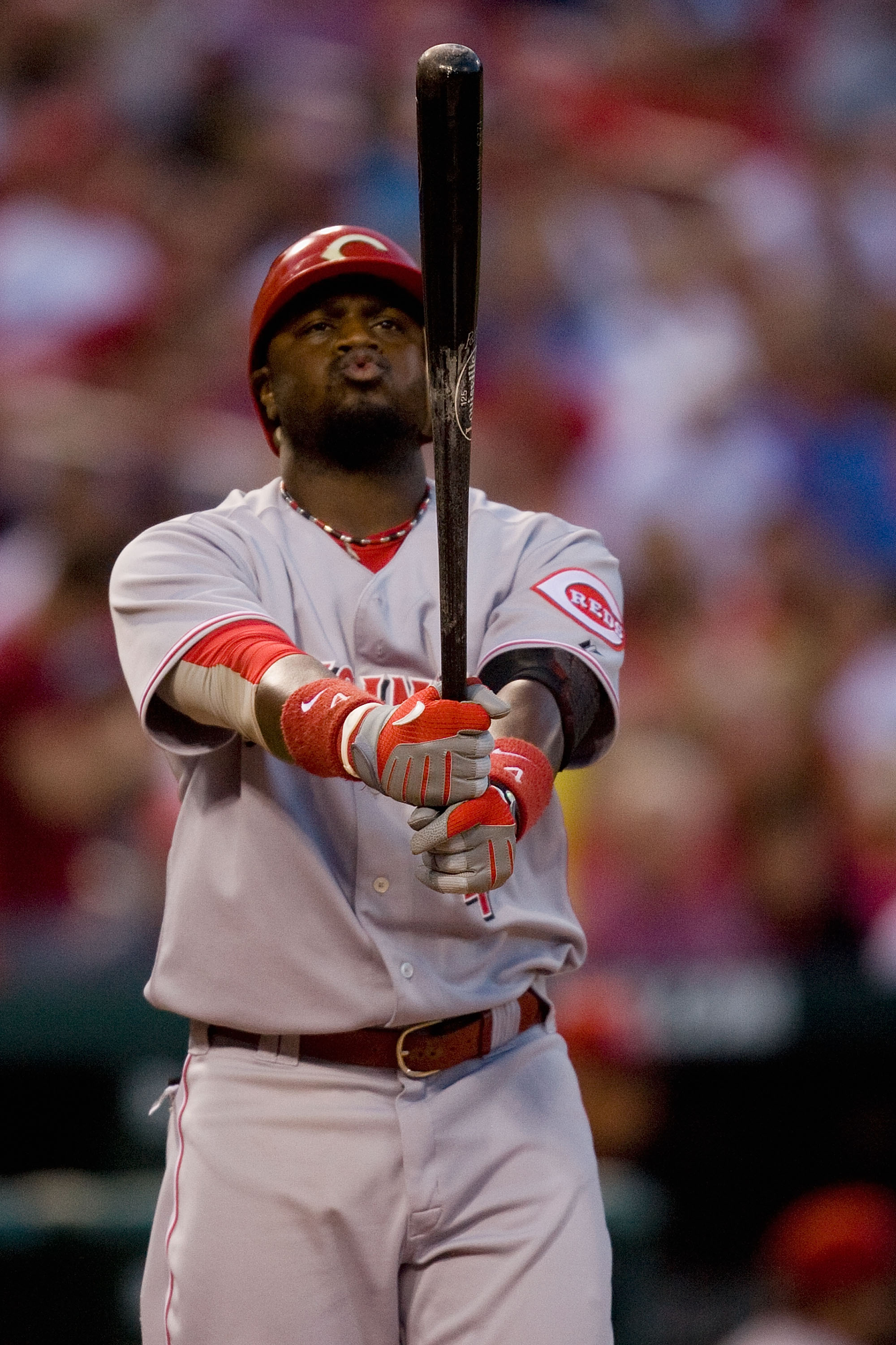 ST. LOUIS - SEPTEMBER 3: Brandon Phillips #4 of the Cincinnati Reds gets ready to bat against the St. Louis Cardinals at Busch Stadium on September 3, 2010 in St. Louis, Missouri.  (Photo by Dilip Vishwanat/Getty Images)