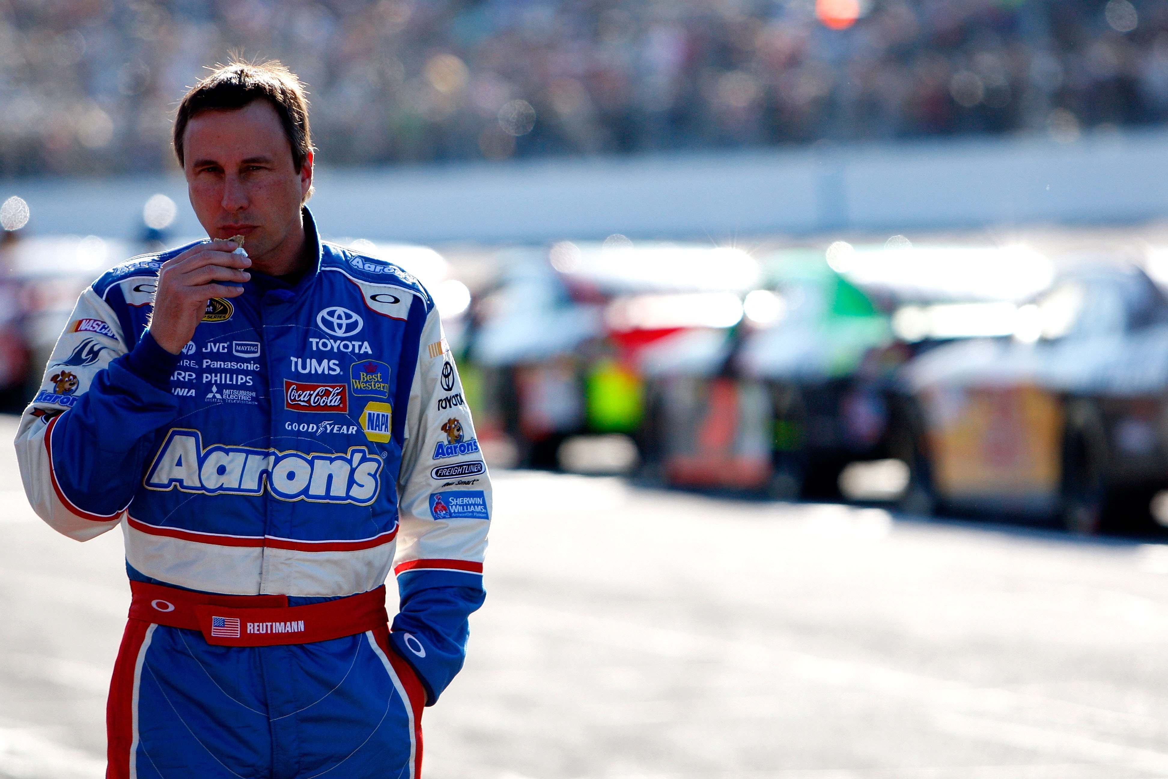 DAYTONA BEACH, FL - FEBRUARY 14:  David Reutimann, driver of the #00 Aaron's Dream Machine Toyota, walks on pit road during a red flag stoppage due to track damage during the NASCAR Sprint Cup Series Daytona 500 at Daytona International Speedway on Februa