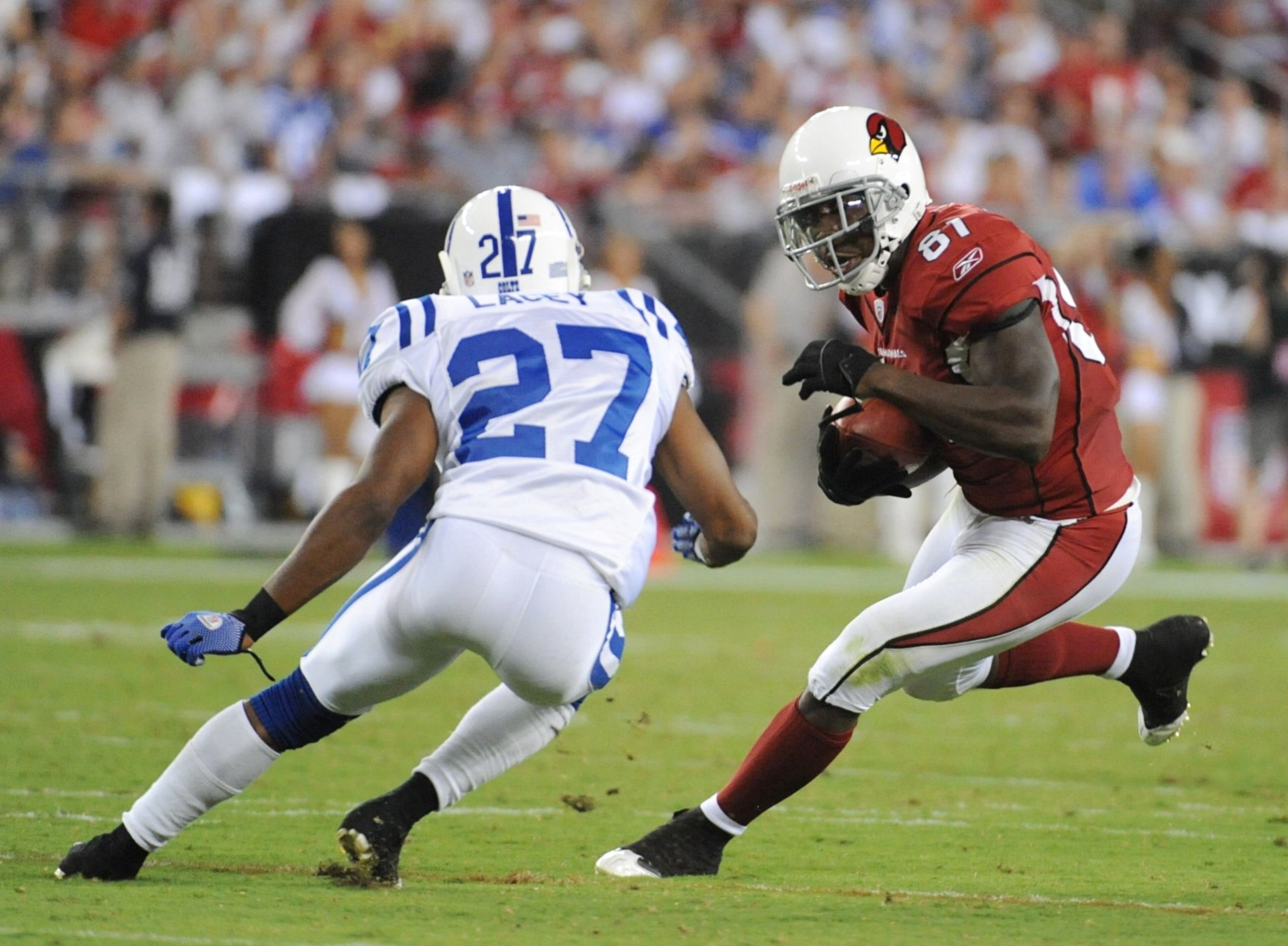 GLENDALE, AZ - SEPTEMBER 27:  Anquan Boldin #81 of the Arizona Cardinals runs after the catch against Jacob Lacey #27 of the Indianapolis Colts in the second quarter during the game at University of Phoenix Stadium on September 27, 2009 in Glendale, Arizo