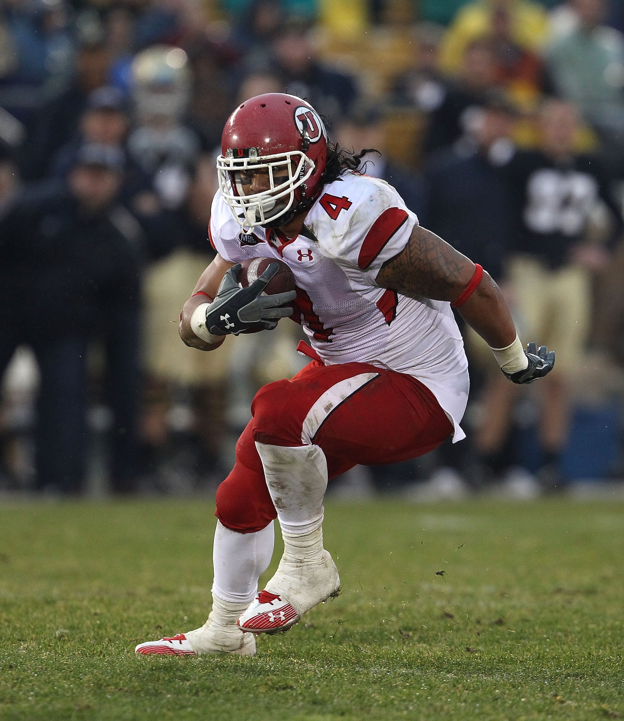 SOUTH BEND, IN - NOVEMBER 13: Matt Asiata #4 of the Utah Utes runs against the Notre Dame Fighting Irish at Notre Dame Stadium on November 13, 2010 in South Bend, Indiana. Notre Dame defeated Utah 28-3. (Photo by Jonathan Daniel/Getty Images)