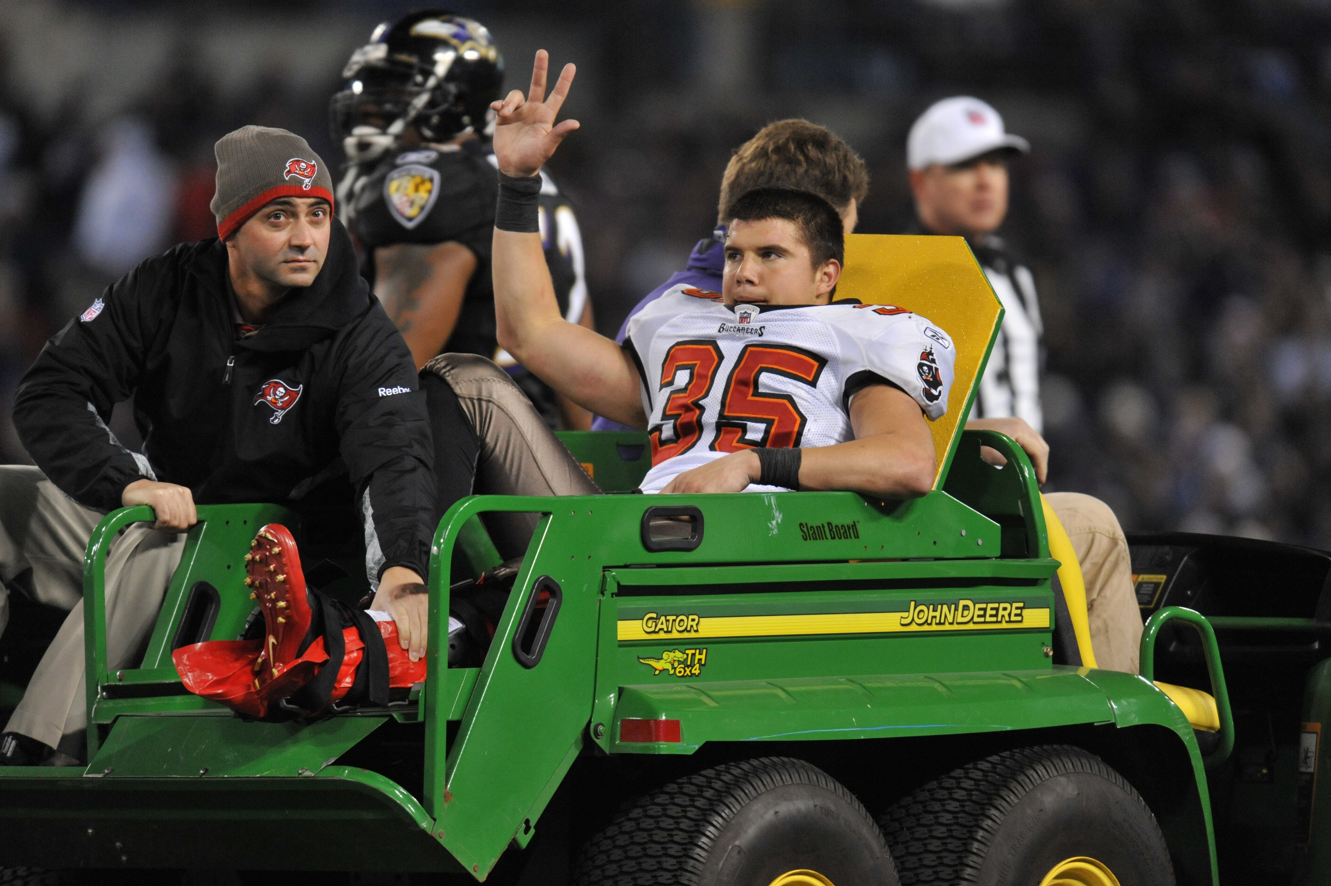 BALTIMORE, MD - NOVEMBER 28:  Cody Grimm #35 of the Tampa Bay Buccaneers is carted off the field after breaking his leg during the game against the Baltimore Ravens at M&T Bank Stadium on November 28, 2010 in Baltimore, Maryland. The Ravens defeated the B