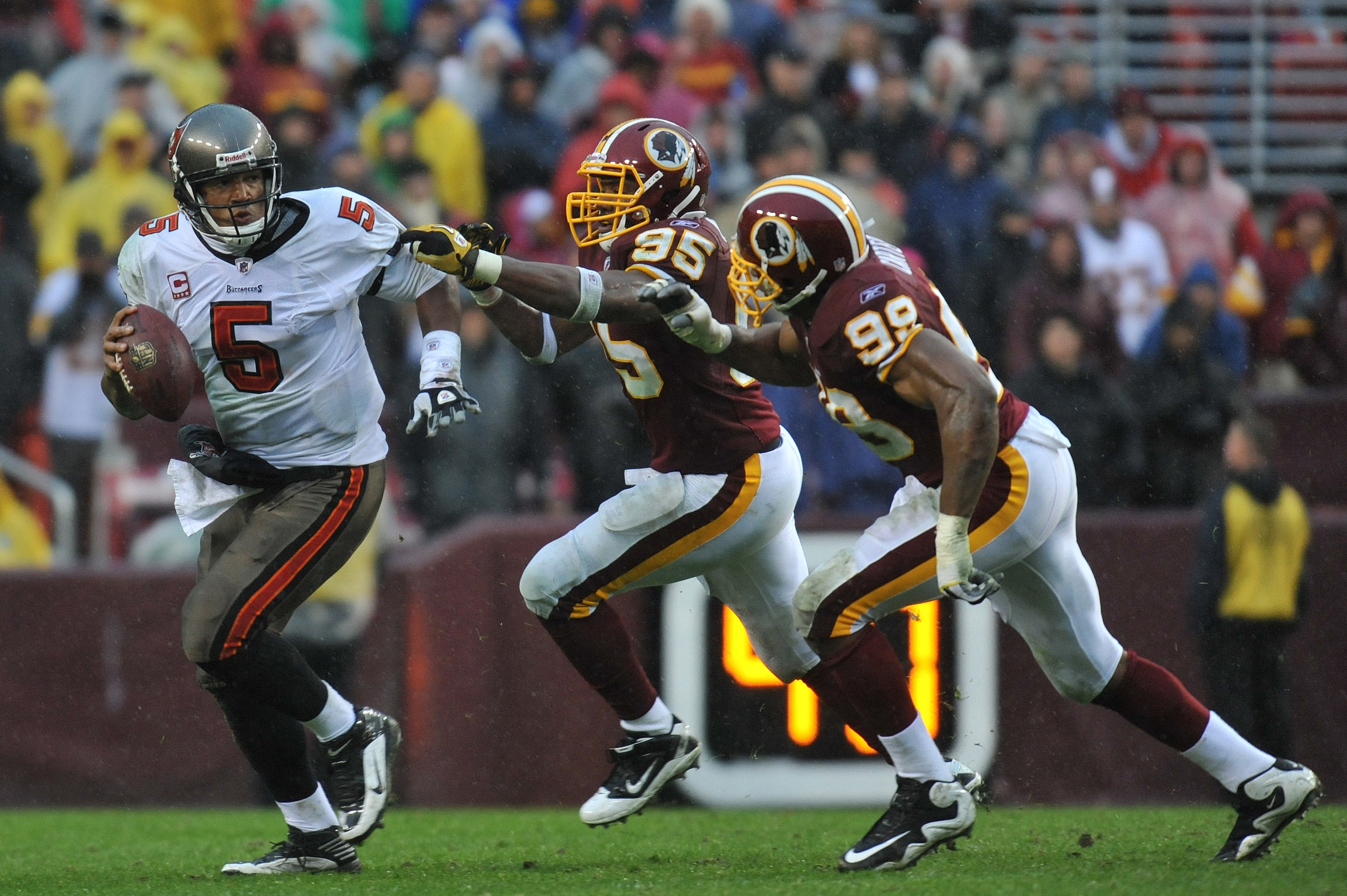 LANDOVER, MD - DECEMBER 12:  Josh Freeman #5 of the Tampa Bay Buccaneers scrambles during the game against the Washington Redskins  at FedExField on December 12, 2010 in Landover, Maryland. The Buccaneers defeated the Redskins 17-16. (Photo by Larry Frenc