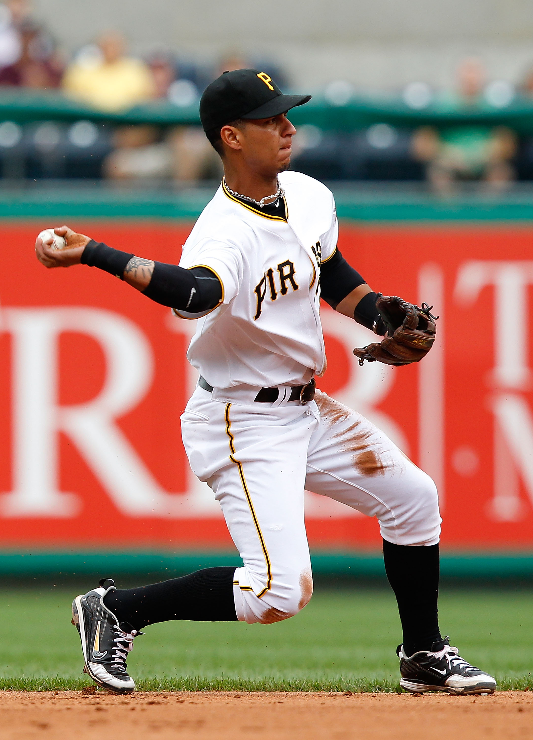 PITTSBURGH - SEPTEMBER 06:  Ronny Cedeno #13 of the Pittsburgh Pirates throws to first base during the game against the Atlanta Braves on September 6, 2010 at PNC Park in Pittsburgh, Pennsylvania. The Pirates beat the Braves 3-1.  (Photo by Jared Wickerha