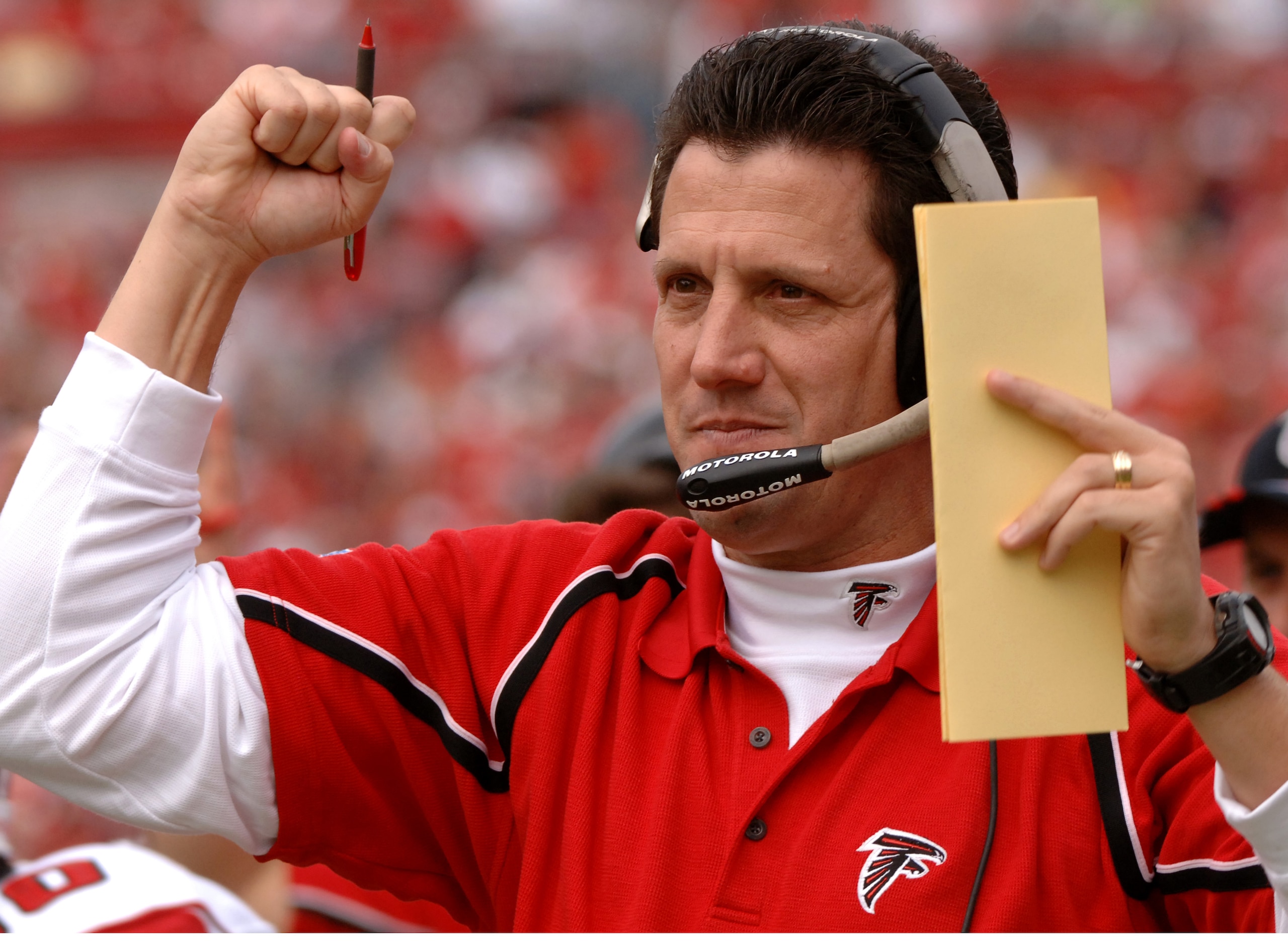 Atlanta Falcons offfensive coordinator  Greg Knapp cheers a touchdown against the Tampa Bay Buccaneers  December 24, 2005 in Tampa.  The Bucs defeated the Falcons 27 - 24 in overtime.  (Photo by Al Messerschmidt/Getty Images)