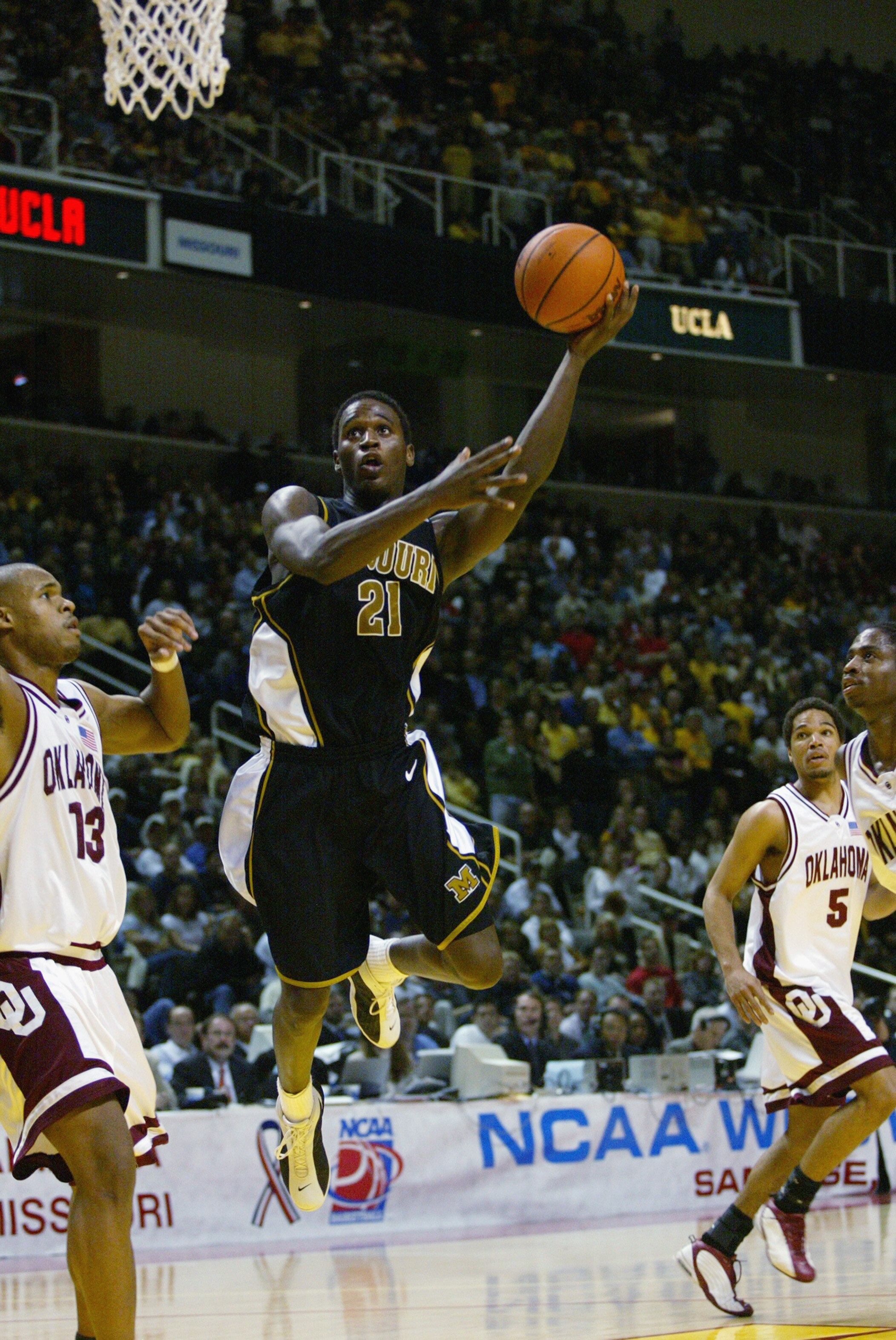 SAN JOSE, CA - MARCH 23:  Kareem Rush #21 of the Missouri Tigers goes to the basket during the West Regional Final of the 2002 NCAA Men's Basketball Tournament against the Oklahoma Sooners on March 23, 2002 at Compaq Center in San Jose, California.  The S