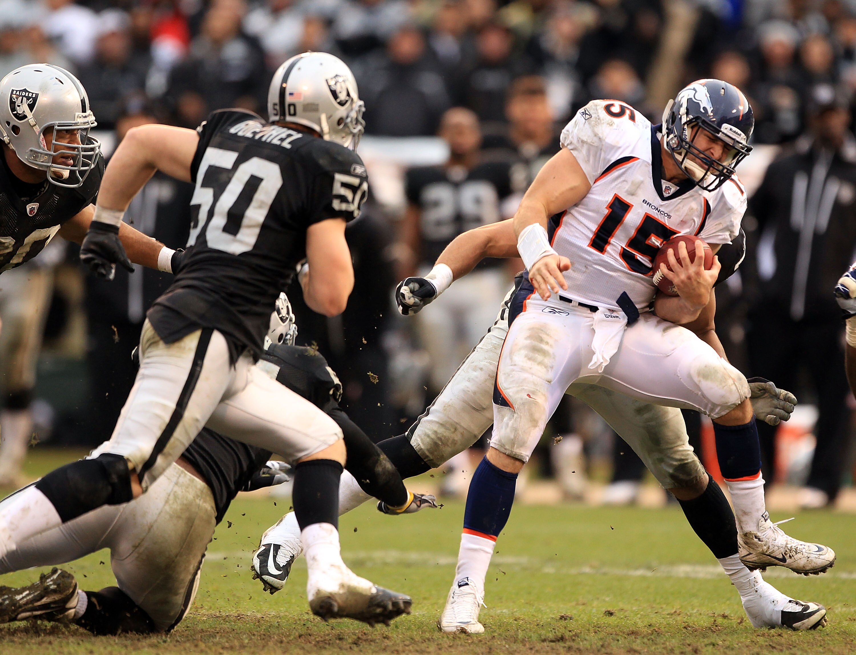 OAKLAND, CA - DECEMBER 19:  Tim Tebow #15 of the Denver Broncos runs with the ball against the Oakland Raiders at Oakland-Alameda County Coliseum on December 19, 2010 in Oakland, California.  (Photo by Ezra Shaw/Getty Images)