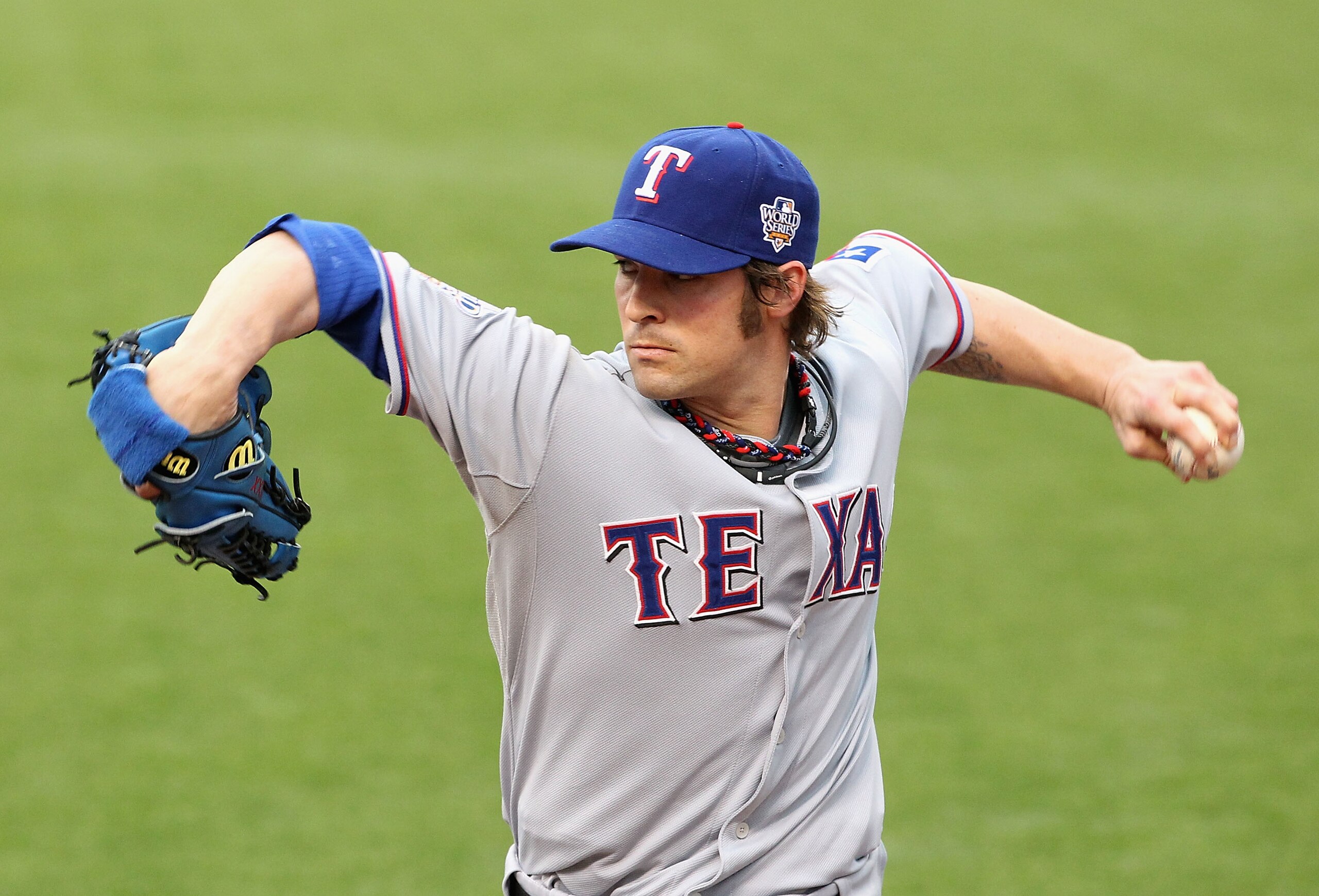 SAN FRANCISCO - OCTOBER 28:  Starting pitcher C.J. Wilson #36 of the Texas Rangers warms up in the bullpen before taking on the San Francisco Giants in Game Two of the 2010 MLB World Series at AT&T Park on October 28, 2010 in San Francisco, California.  (