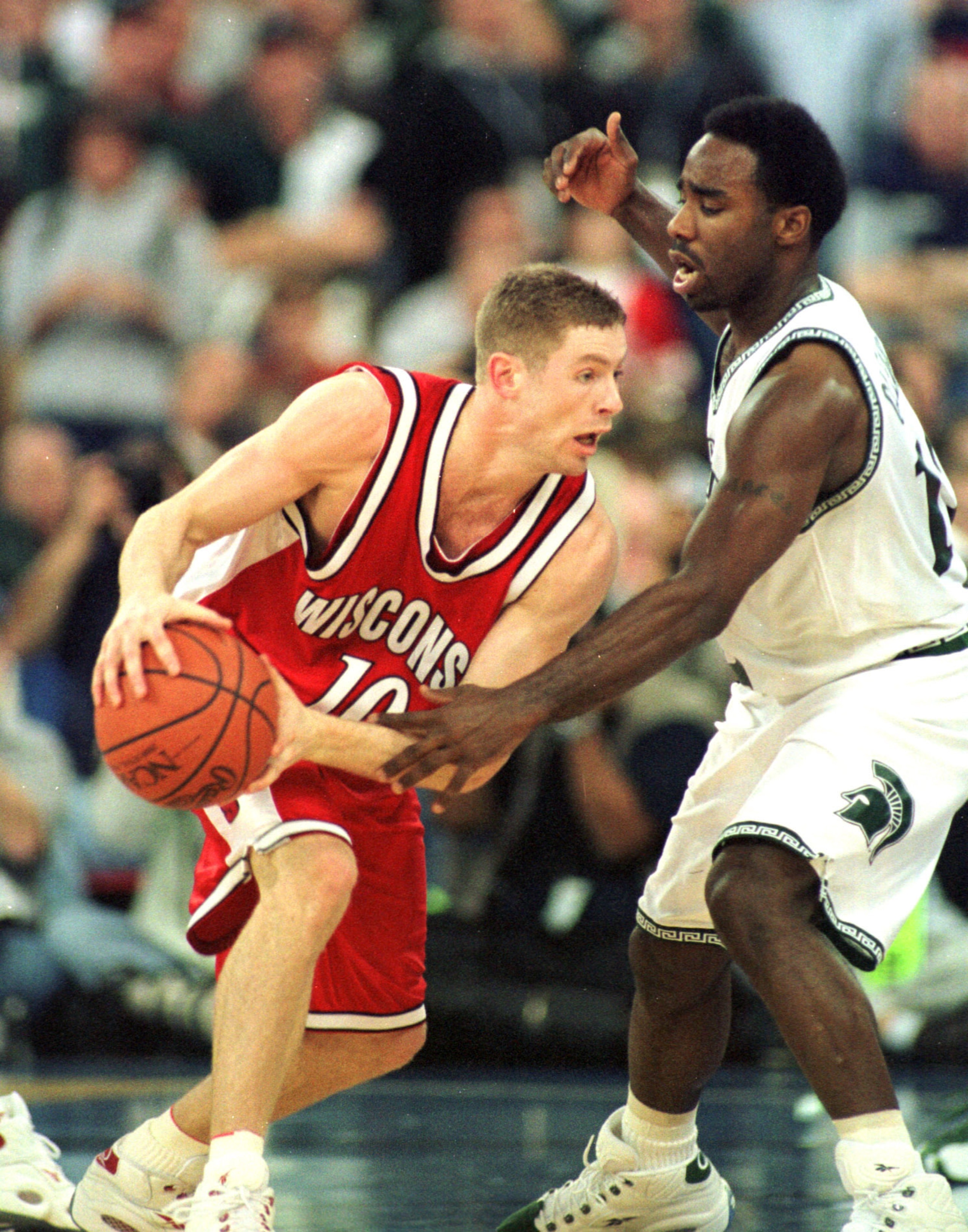 1 Apr 2000:  Jon Bryant #10 of Wisconsin tries to dribble around Mateen Cleaves #12 of Michigan State during the semifinal round of the NCAA Final Four at the RCA Dome in Indianapolis, Indiana.  Mandatory Credit: Jed Jacobsohn/ALLSPORT