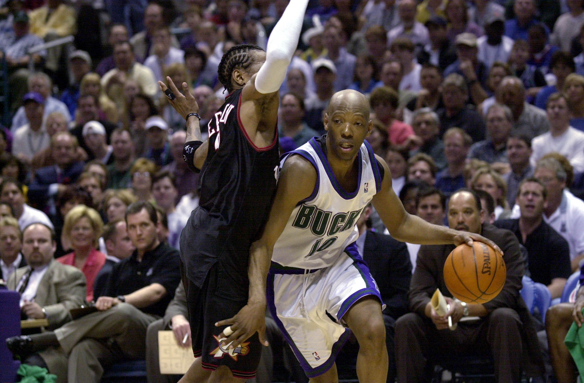 28 May 2001:  Sam Cassell #10 of the Milwaukee Bucks is defended by Allen Iverson #33 of the Philadelphia 76ers in game four of the eastern conference finals at the Bradley Center in Milwaukee, Wisconsin.  The 76ers won 89-83.  DIGITAL IMAGE.  Mandatory C