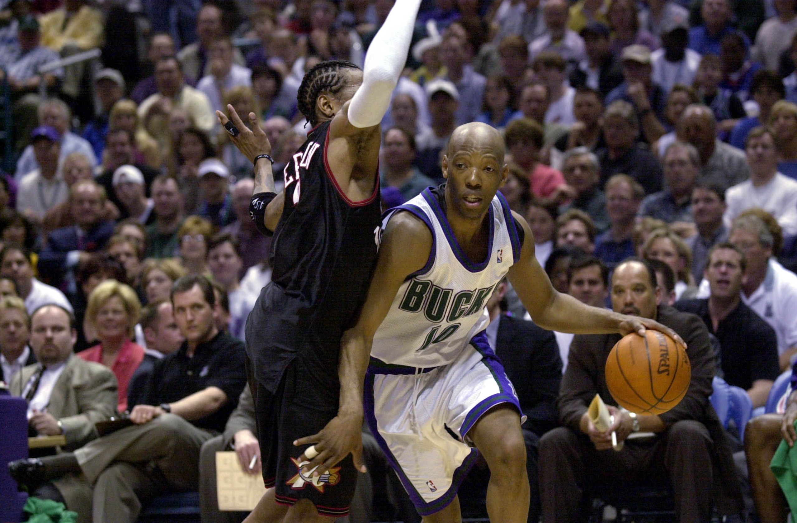 28 May 2001:  Sam Cassell #10 of the Milwaukee Bucks is defended by Allen Iverson #33 of the Philadelphia 76ers in game four of the eastern conference finals at the Bradley Center in Milwaukee, Wisconsin.  The 76ers won 89-83.  DIGITAL IMAGE.  Mandatory C
